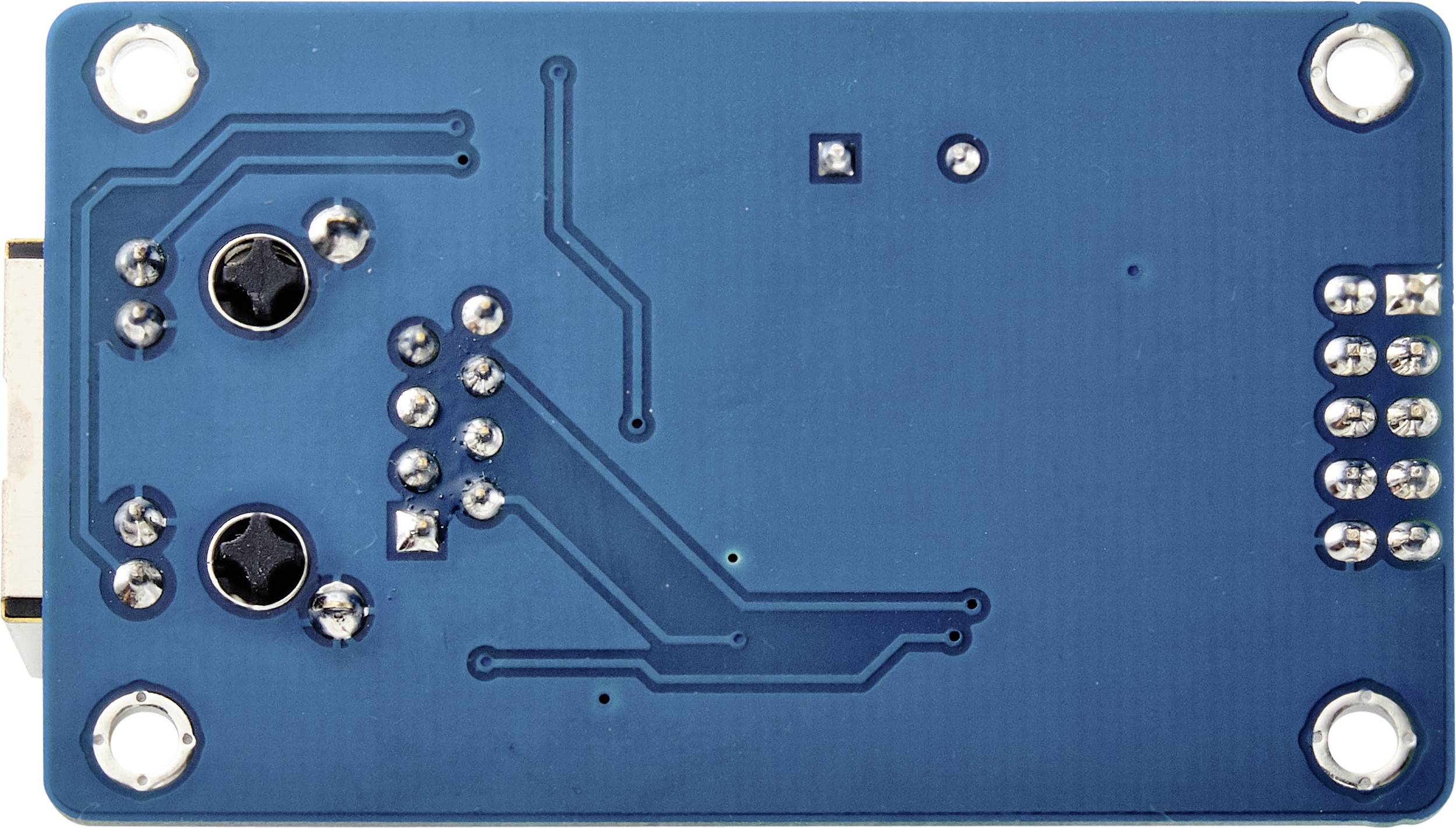 A blue electronic circuit board with multiple solder points, two black screws, and visible circuit traces.