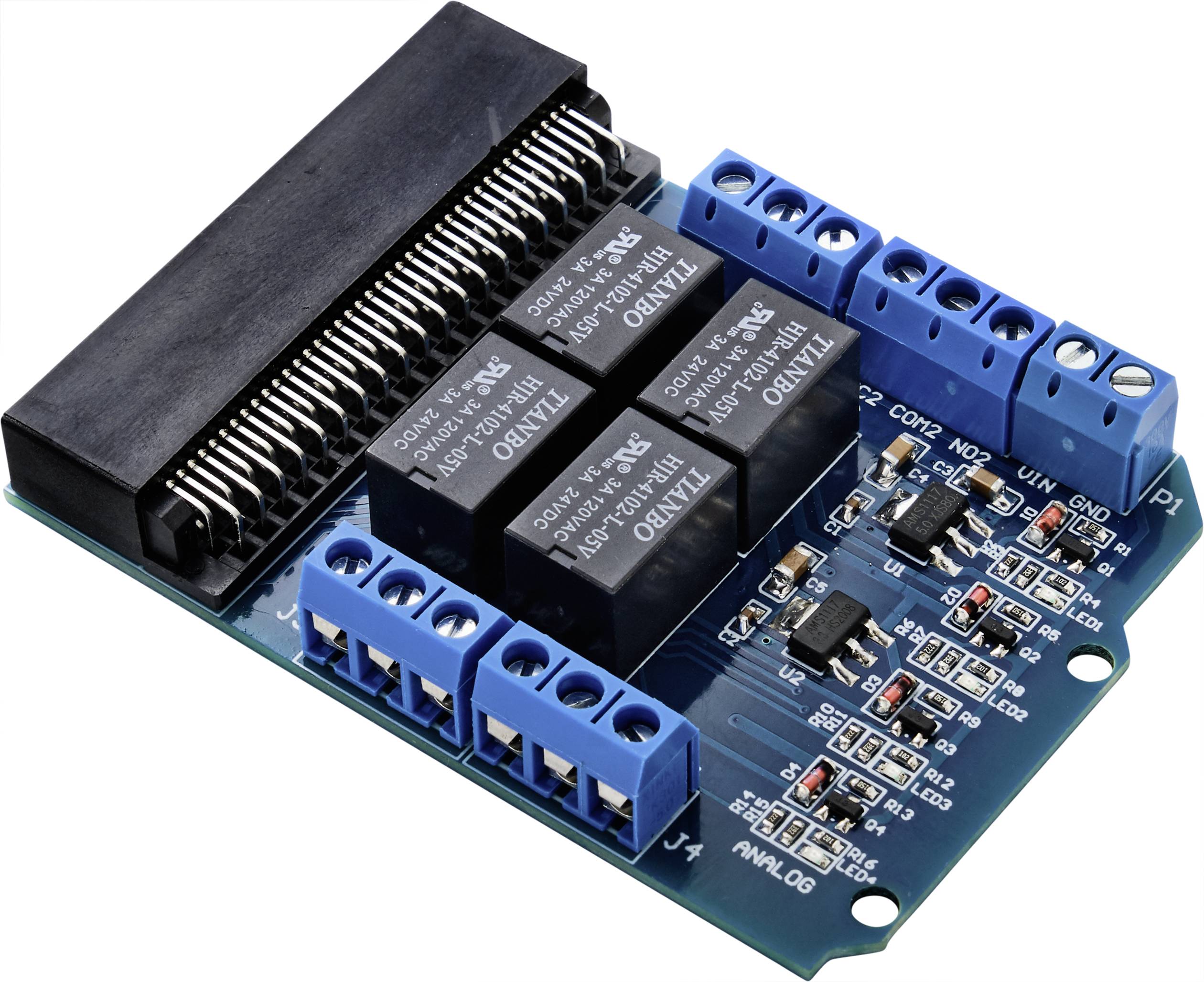 A blue electronic circuit board with multiple blue terminal blocks and black relays.
