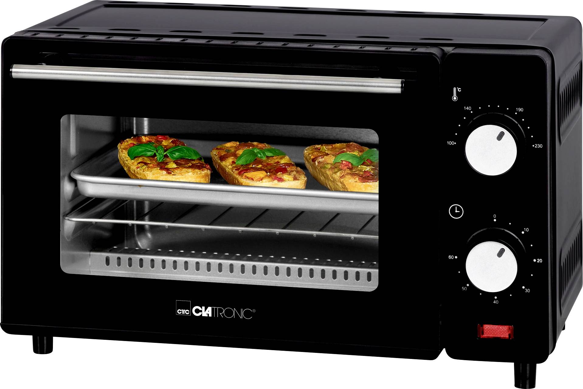 Compact oven with two golden-brown, gratinated dishes on a baking tray. Temperature and time settings visible on the side.