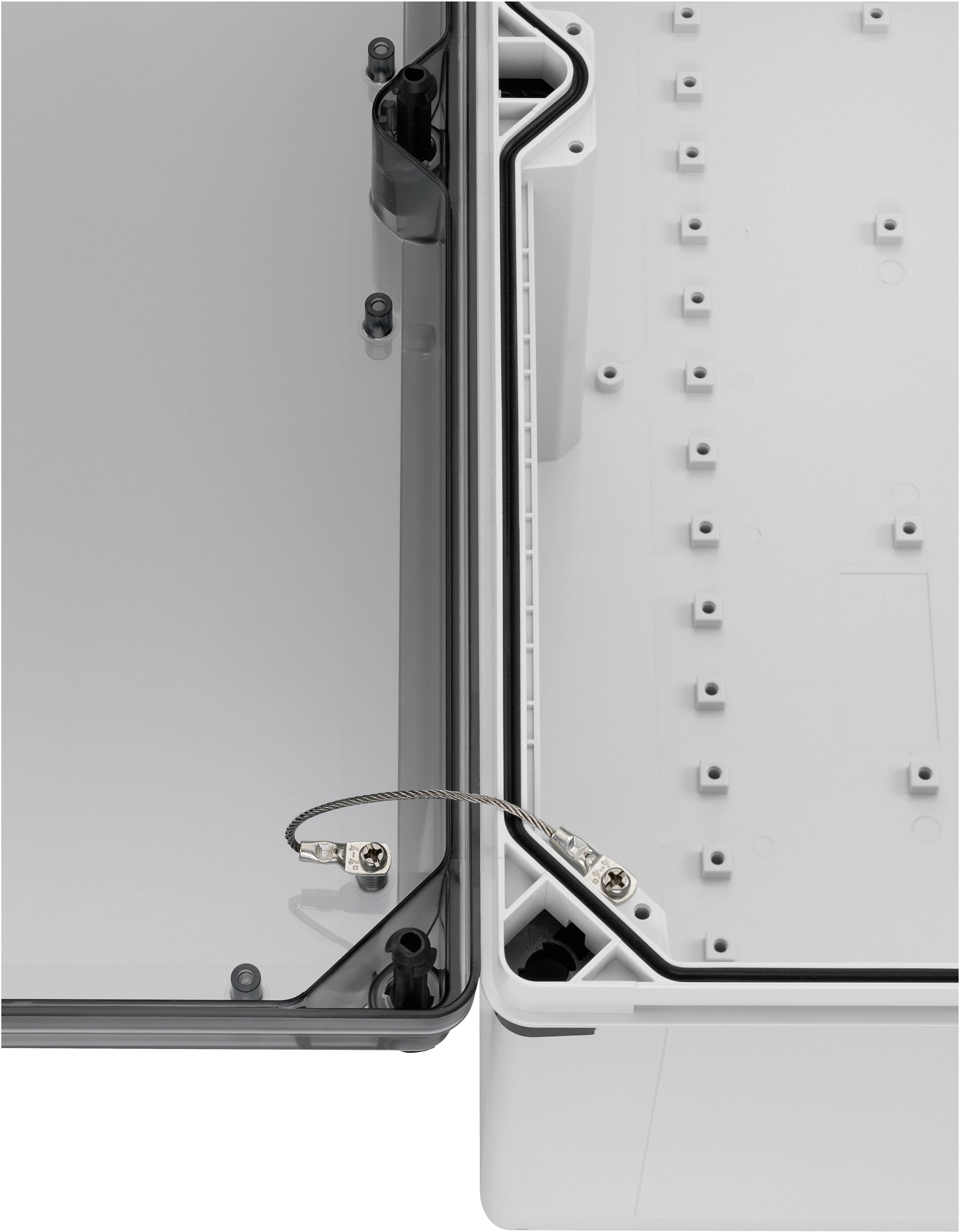 Open electrical enclosure with transparent cover on the left. An earthing cable connects the cover side to the base of the enclosure.