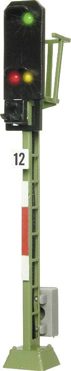 A model railway signal shows a green light at the top, a yellow light in the middle, and a red light at the bottom. A green light signals that the track is clear.