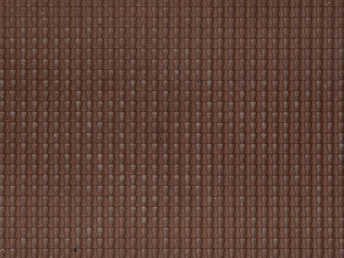 Brown, structured surface with a continuous, geometric pattern of small, regular triangles.