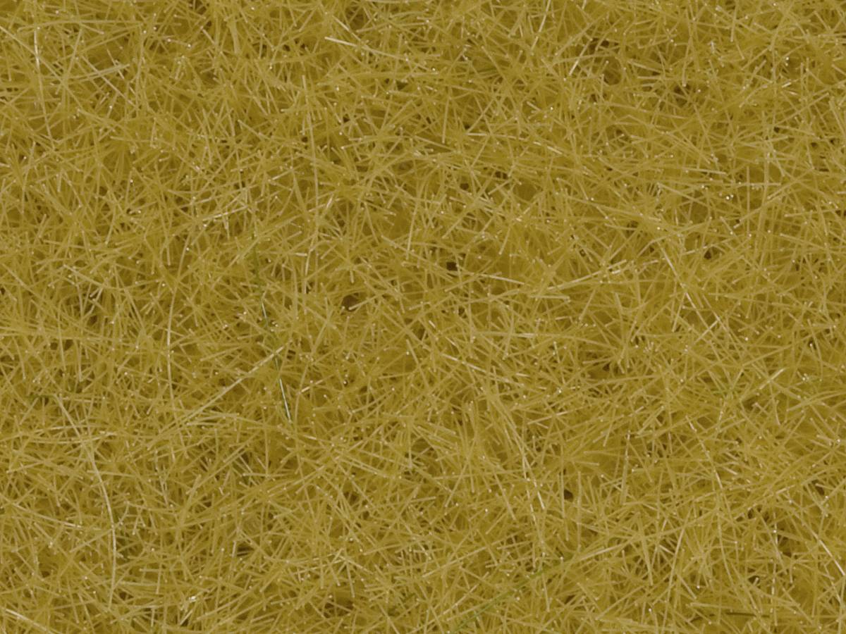 Brown, densely interwoven straw stems in a random pattern.