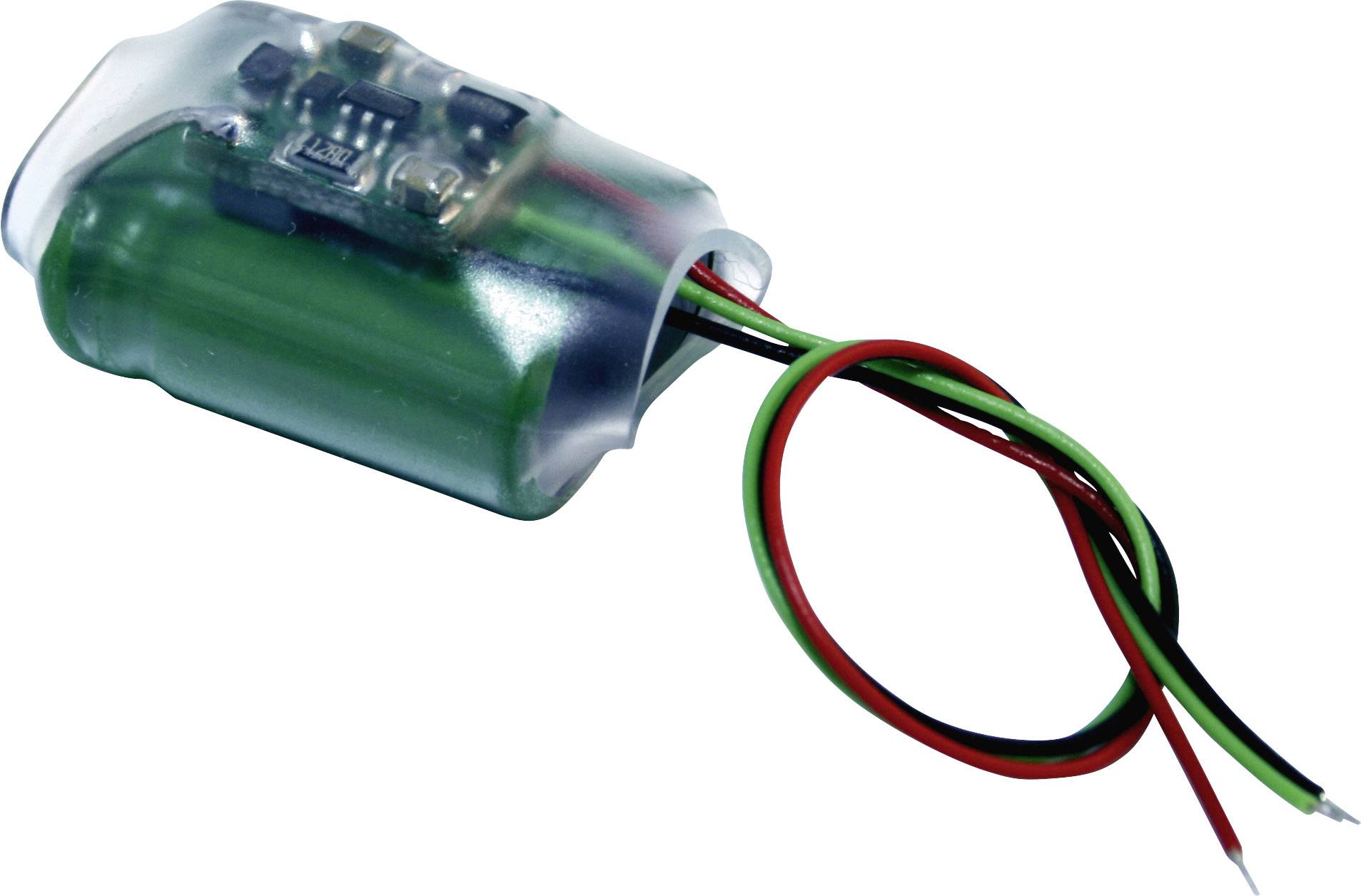 Small electronic device with a green cylinder, transparent casing, and three protruding cables in red, black, and green.