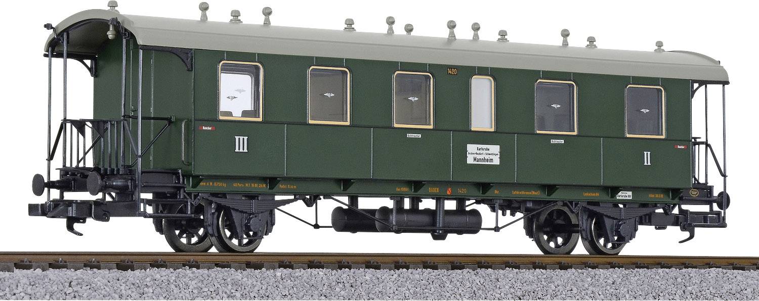 Historical green railway carriage on a track, with the inscription 'Second Class.'