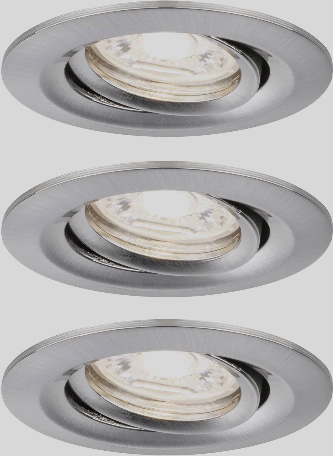 Three silver recessed spotlights, emitting warm white light, mounted in a horizontal row.