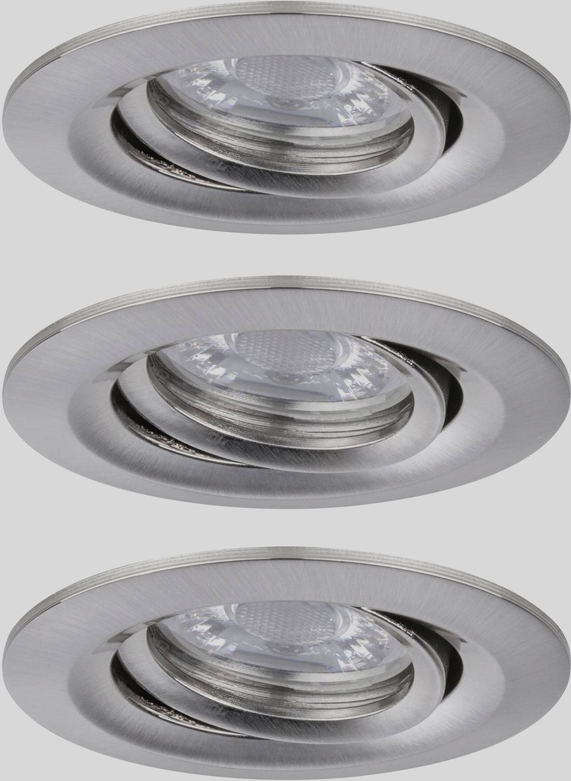 Three round, silver-coloured recessed spotlights with glass covers arranged evenly.