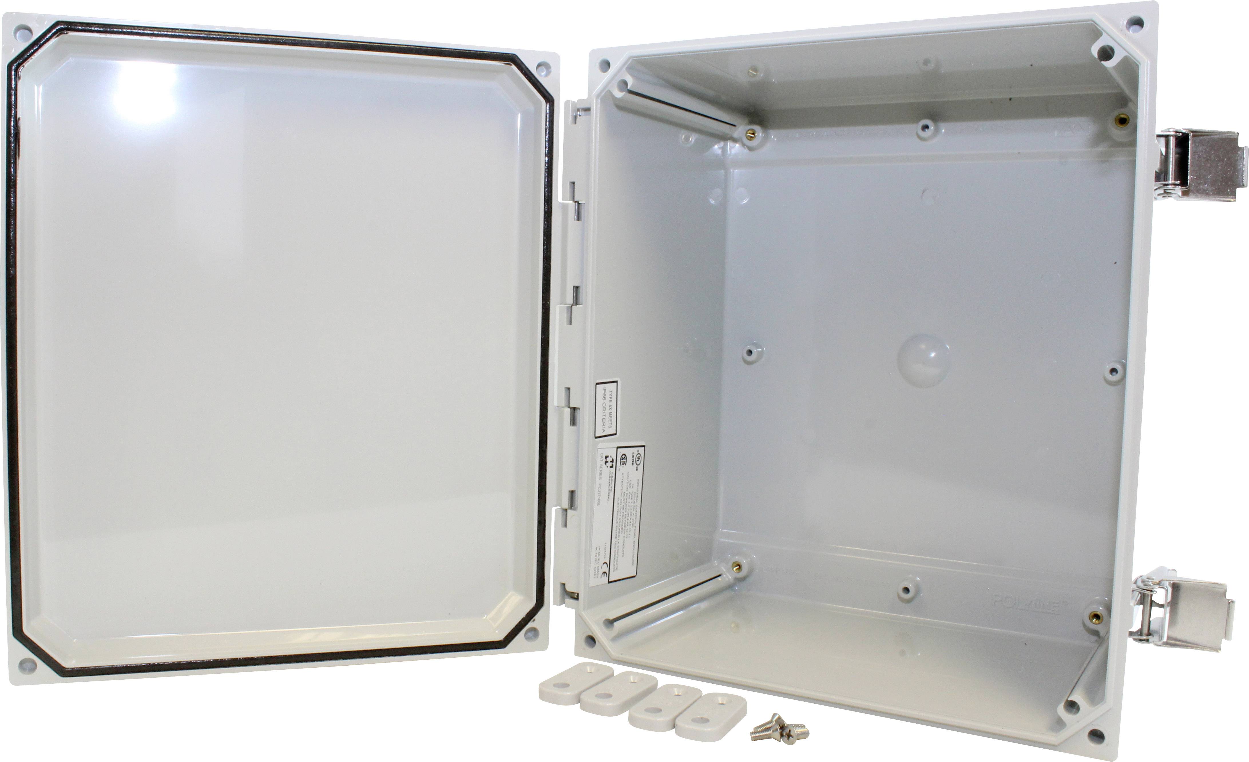 Electrical control cabinet with an open door, revealing the interior and accessory parts such as screws and mounting brackets.