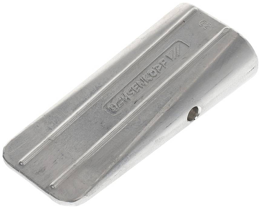 Metal wedge with bevelled edges, punched with 'BECKENKOPP G2', used for machine or construction applications.
