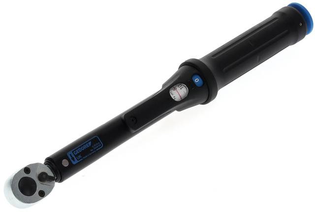A black torque wrench with scale adjustment and a blue accent at one end, used for precise screw tightening.