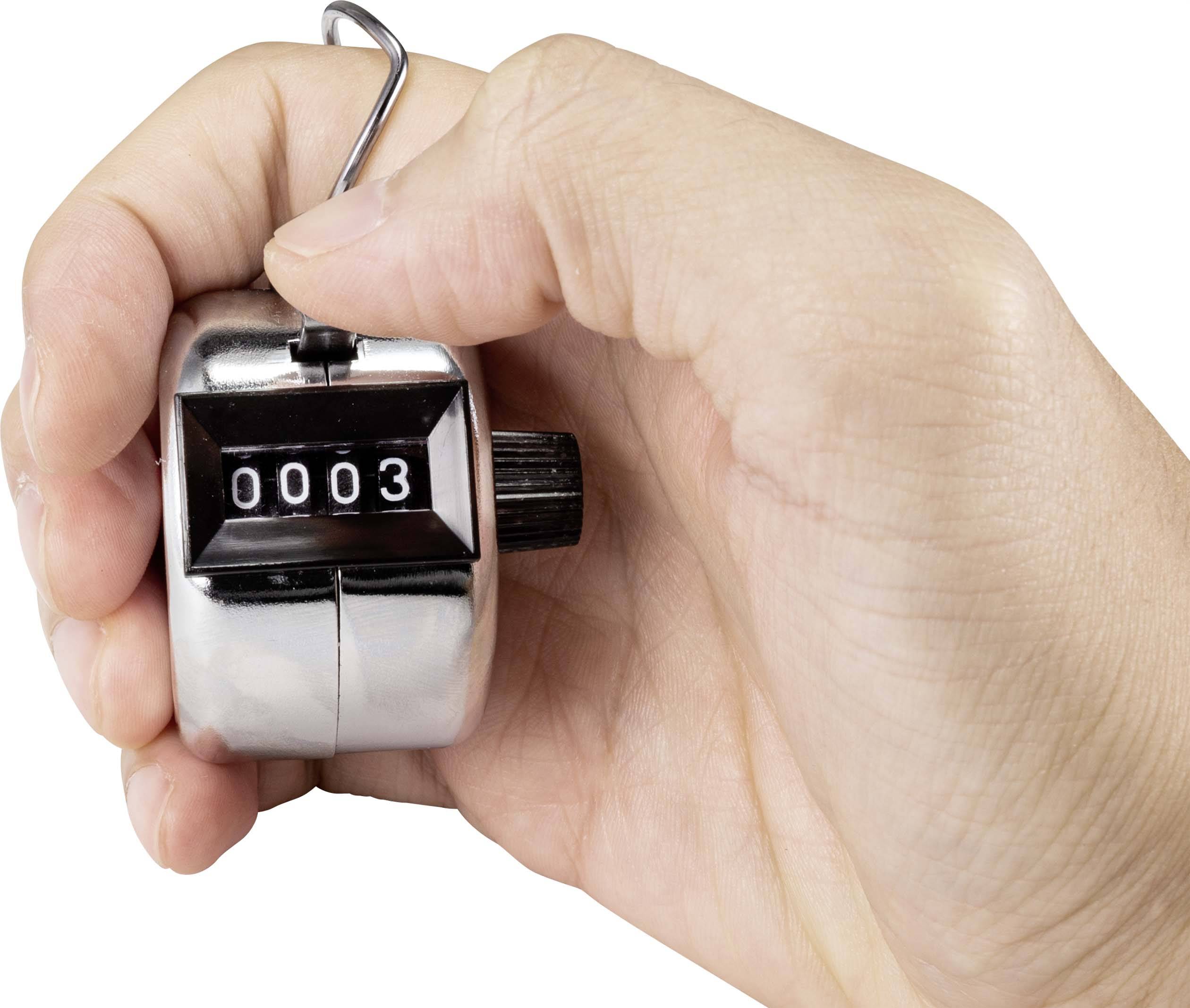 A hand holds a manual tally counter, showing the number '0003'.