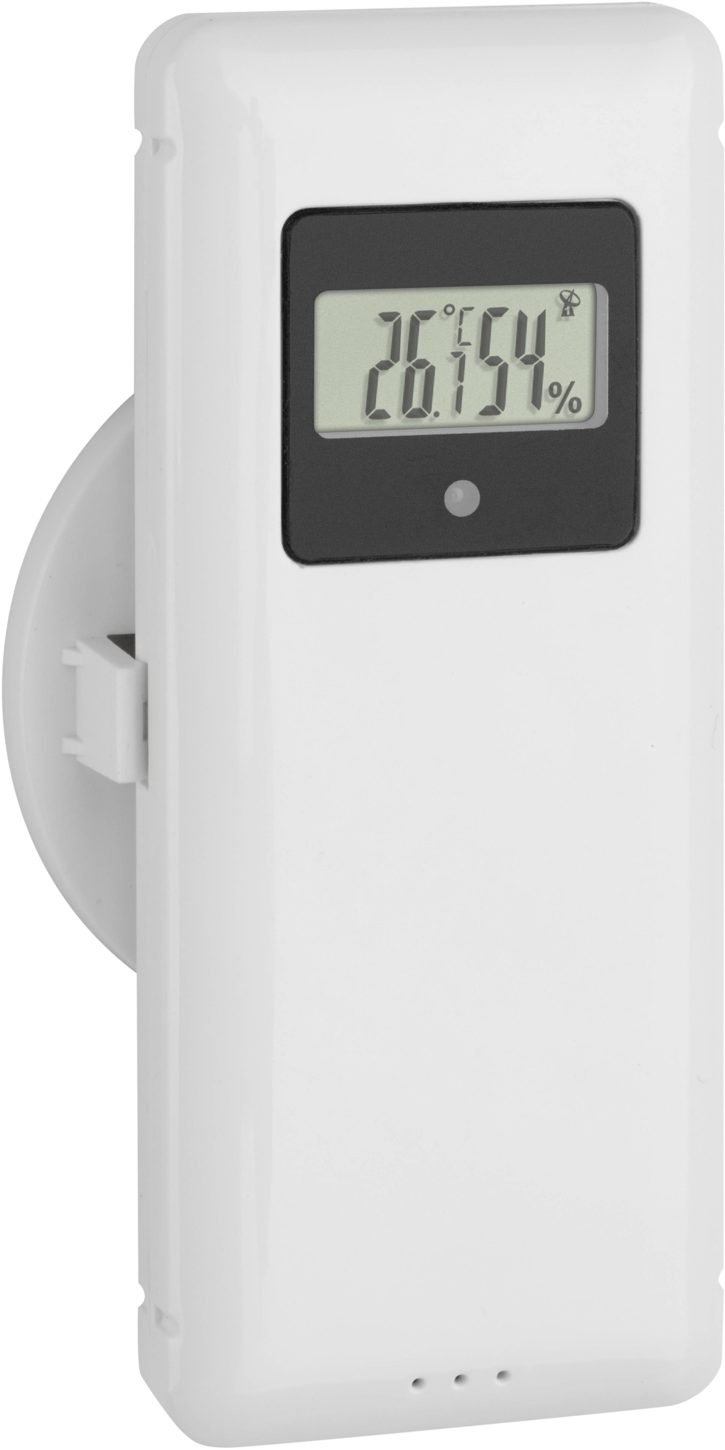 A digital thermometer displays a temperature of 26.5°C. The device is modern and rectangular with a display in the upper section.