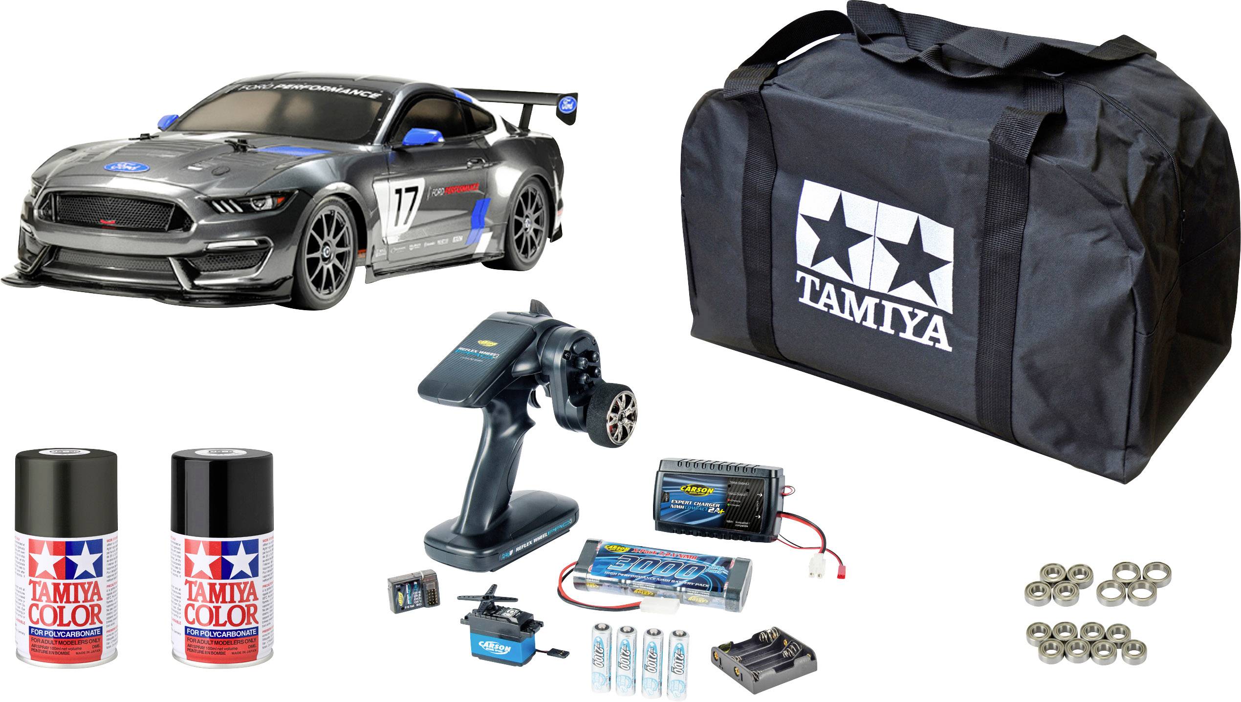 Tamiya RC Car Set with model car, remote control, carry case, paint pots, battery, charger and ball bearings. Perfect for model enthusiasts.