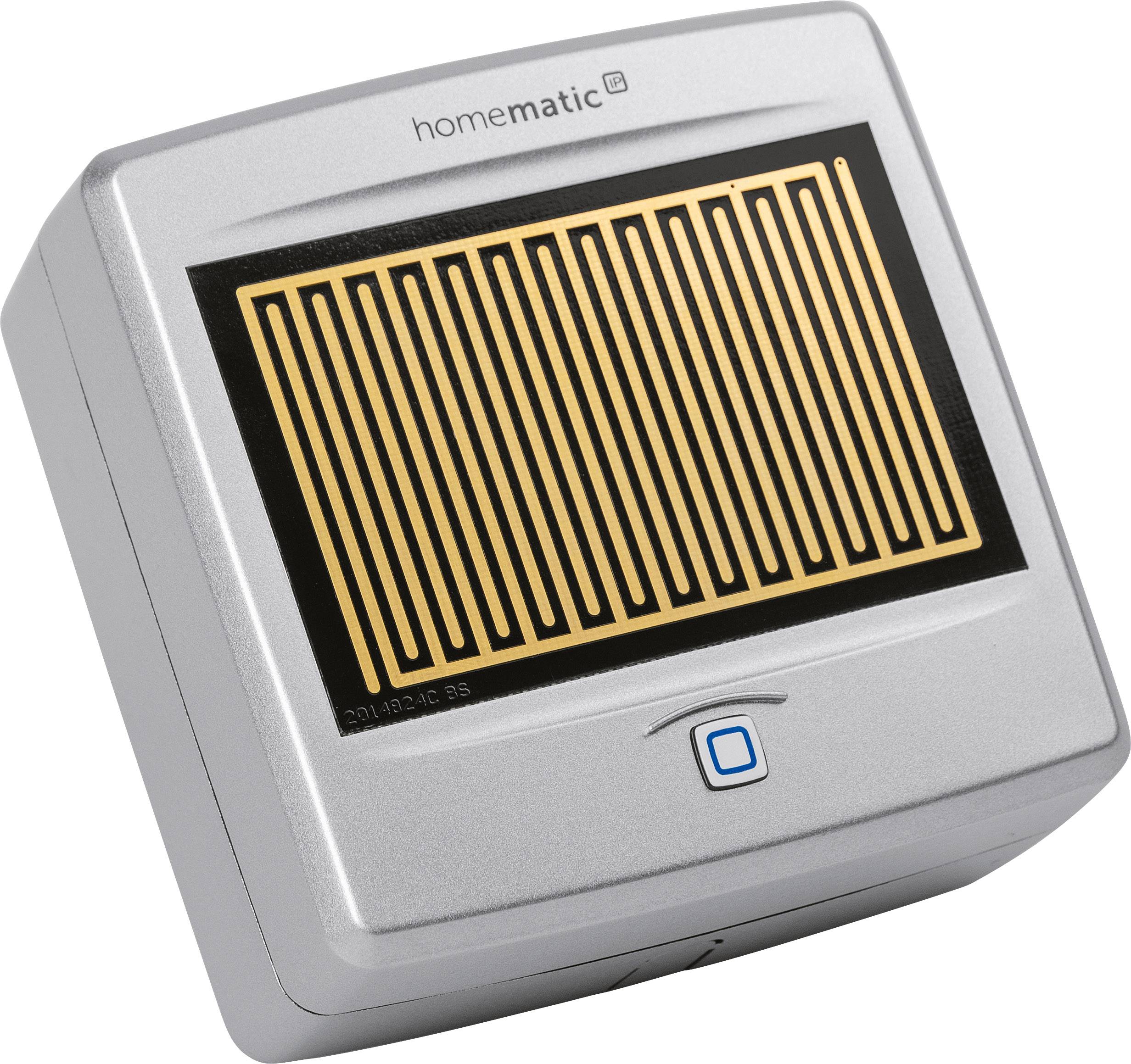 A silver electronic device by Homematic with a rectangular sensor and a square button beneath it.