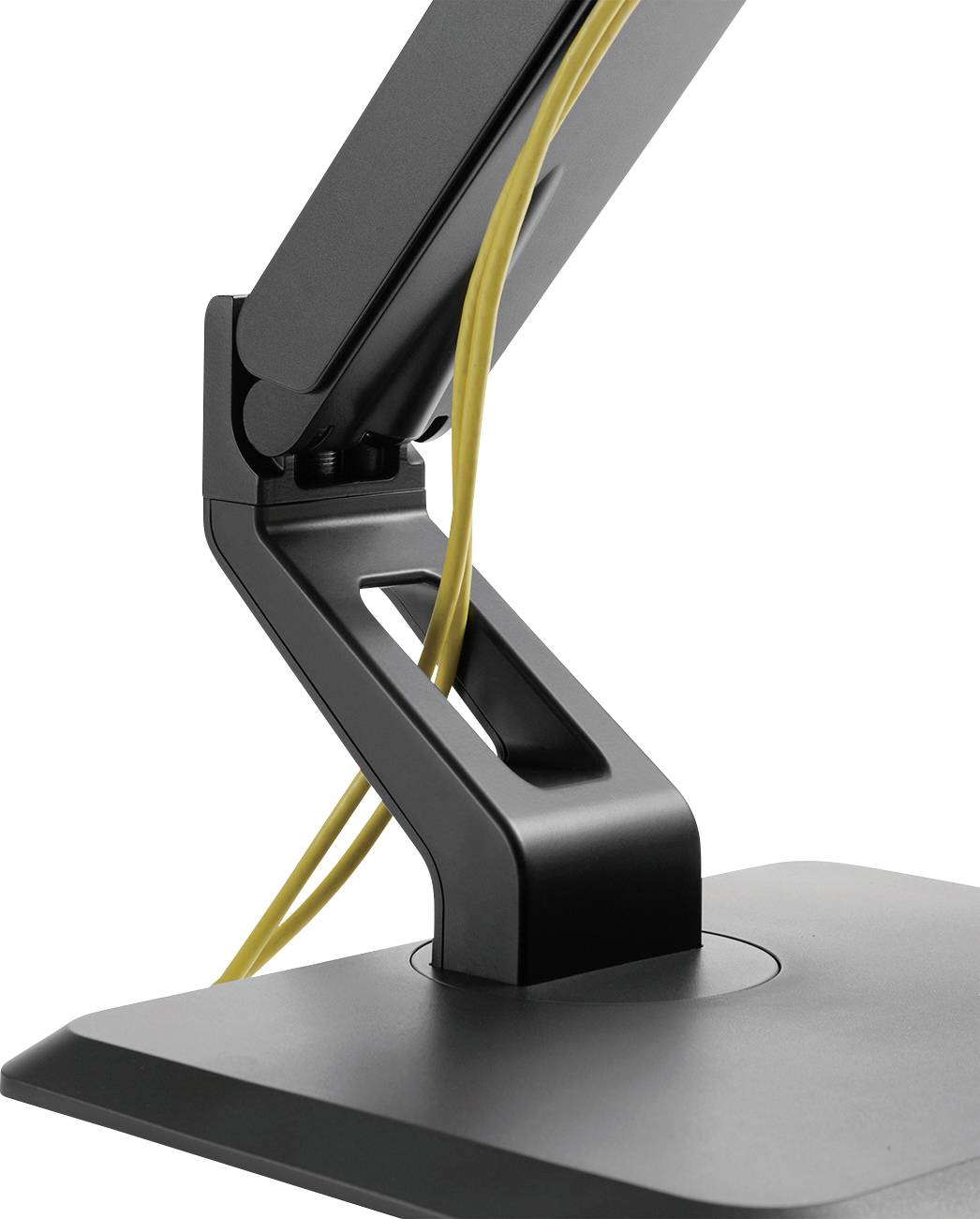 A black monitor arm with yellow cable management, mounted to a desk.