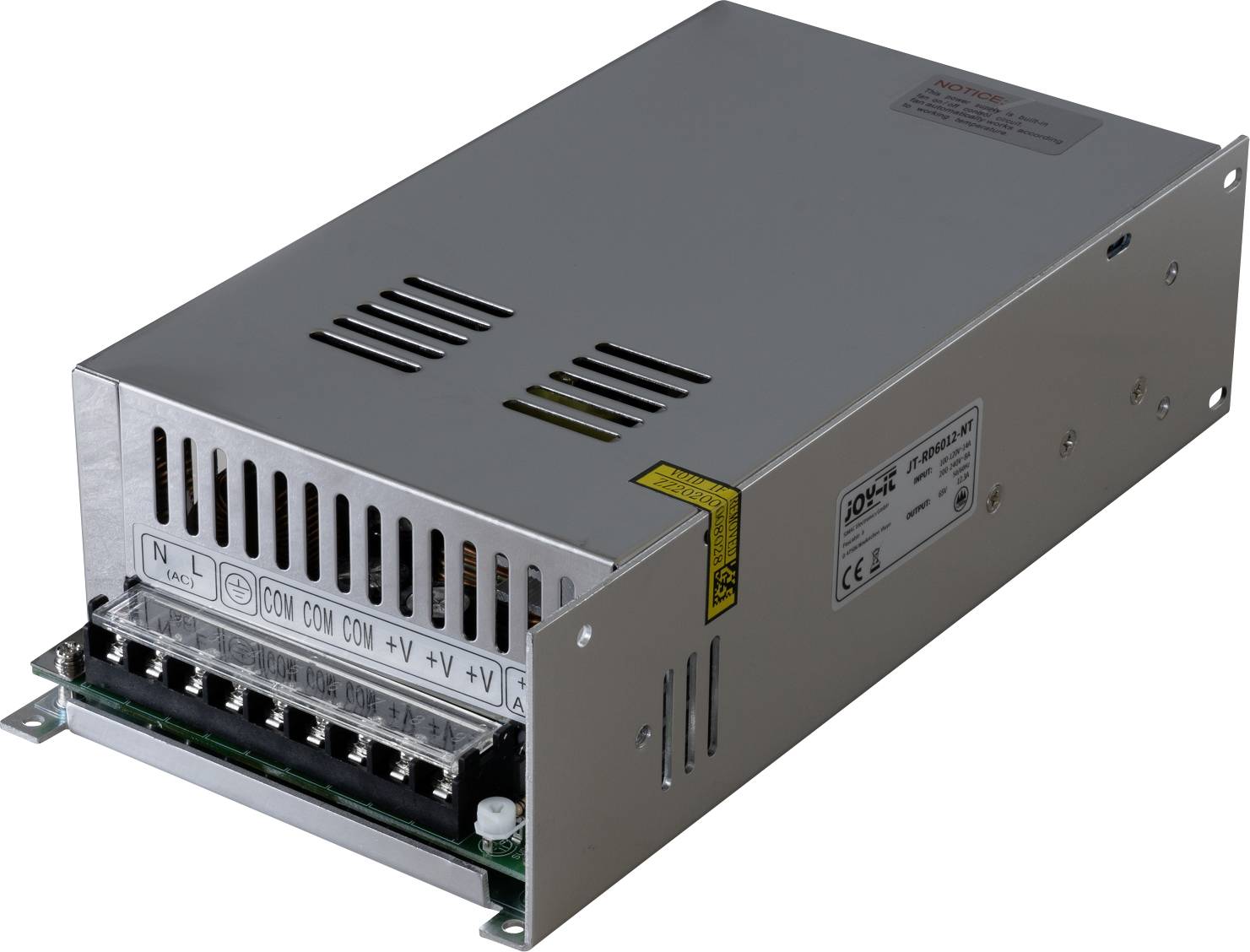 Metallic switch-mode power supply with open grid enclosure, connections and labelling on top. Typical industrial power supply application.