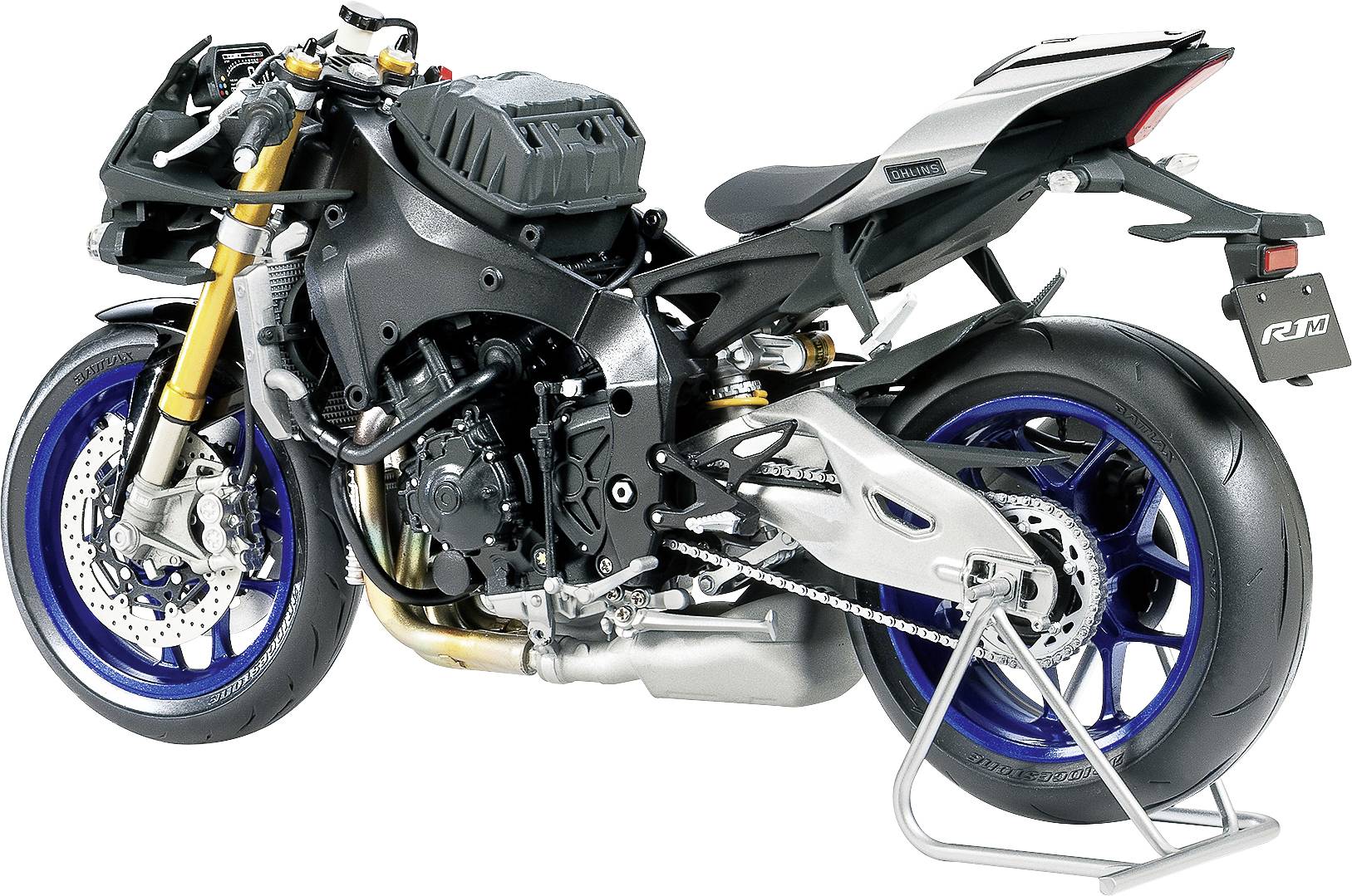 A sporty motorcycle without fairing, revealing its mechanics, with blue rims and a grey fuel tank, mounted on a stand.