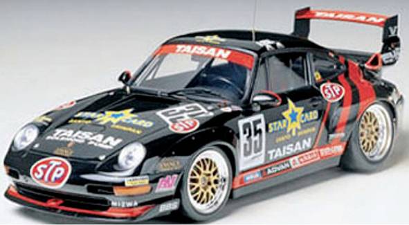 Black racing car model number 35, with red and gold decorative details and various sponsor logos, viewed from a front perspective.