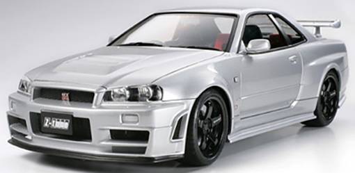 A silver sports car with a distinctive rear spoiler and black alloy wheels, photographed from the side.