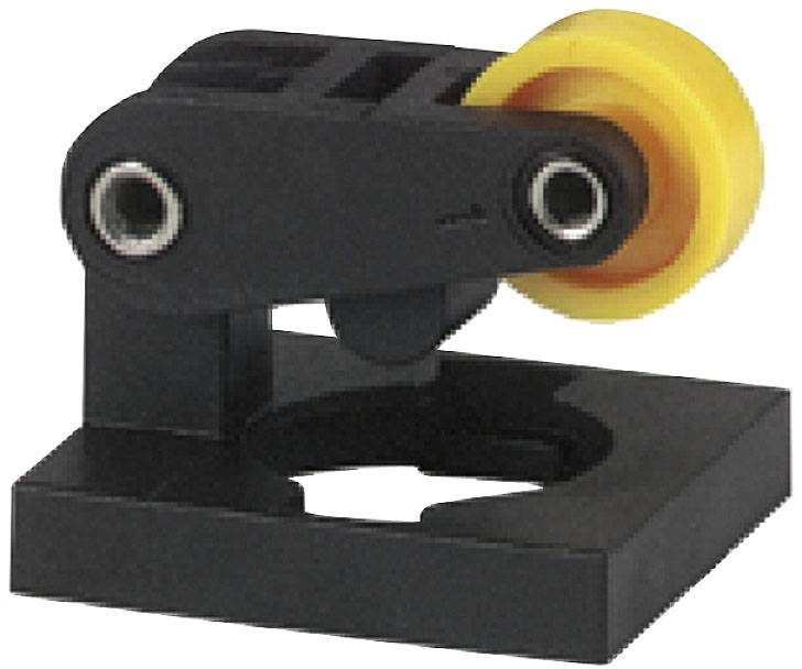 A black machine component with a yellow wheel, mounted on a square base. It appears to be part of a mechanical system.