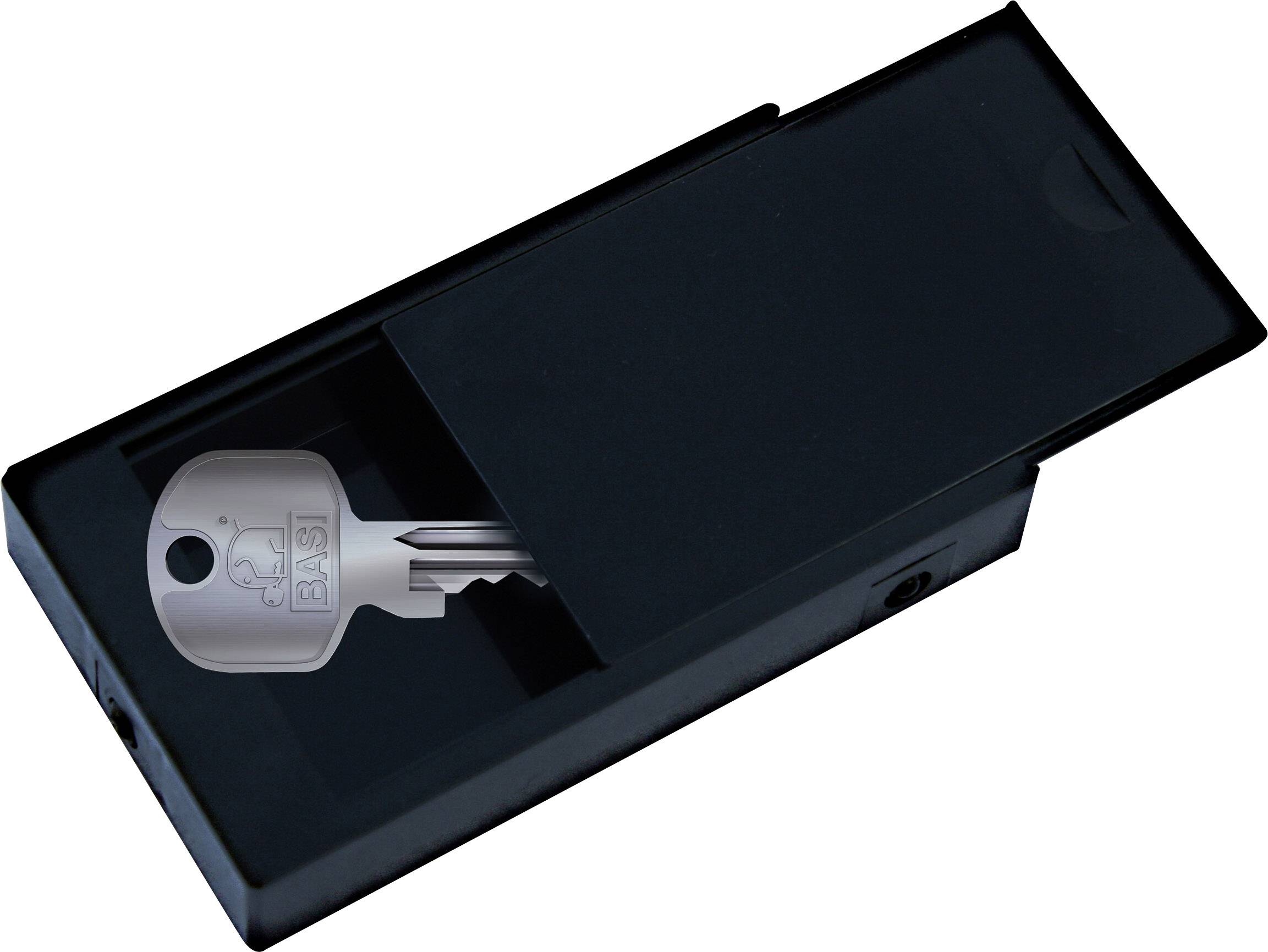 Keys in a black sliding drawer, partially visible.