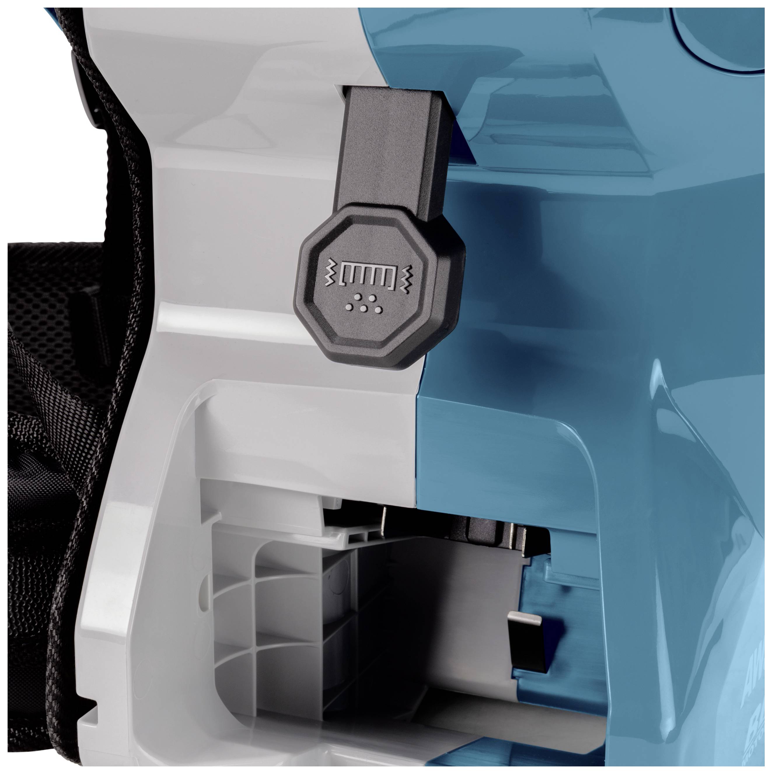 Close-up of an electrical machine with a black switch and an empty compartment, ready for battery replacement.