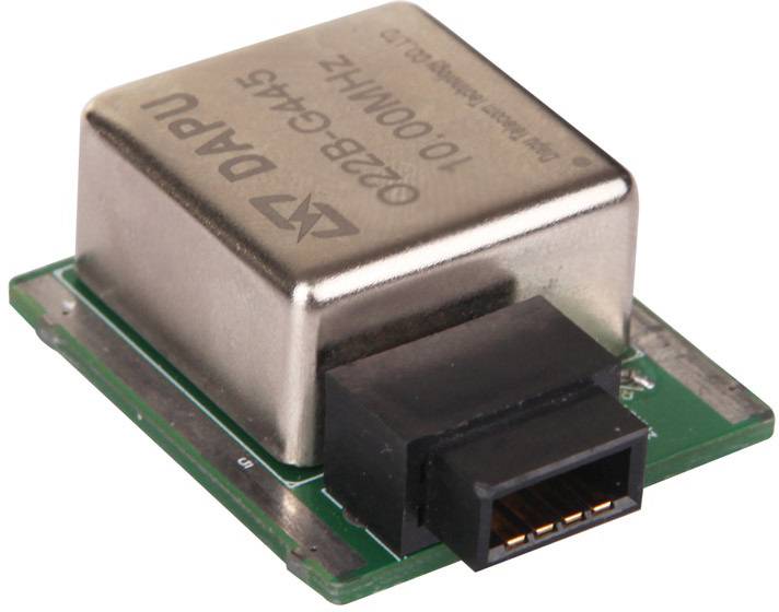 Electronic quartz oscillator on a green circuit board, marked with 10,000 MHz. Used for precise timekeeping in electronic devices.