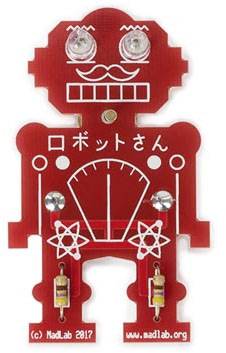 Red circuit board in the shape of a robot with glowing eyes and Japanese text 'ロボットさん'. Components and circuits visible.