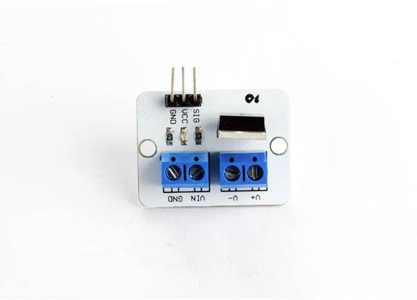 Electronic module with connectors and blue screw terminals on a white background, for use in circuits.