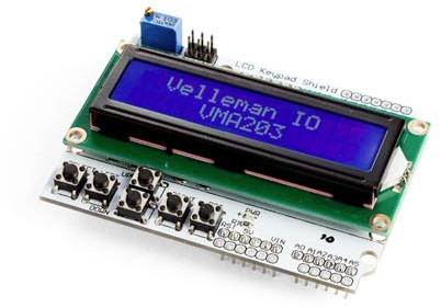 A close-up of an LCD keypad shield, displaying 'Velleman IO VMA203' on the screen. Buttons for menu navigation are visible at the bottom.