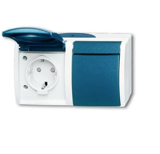 A double socket with a hinged cover. On the left, the socket is visible, on the right a locked flap.