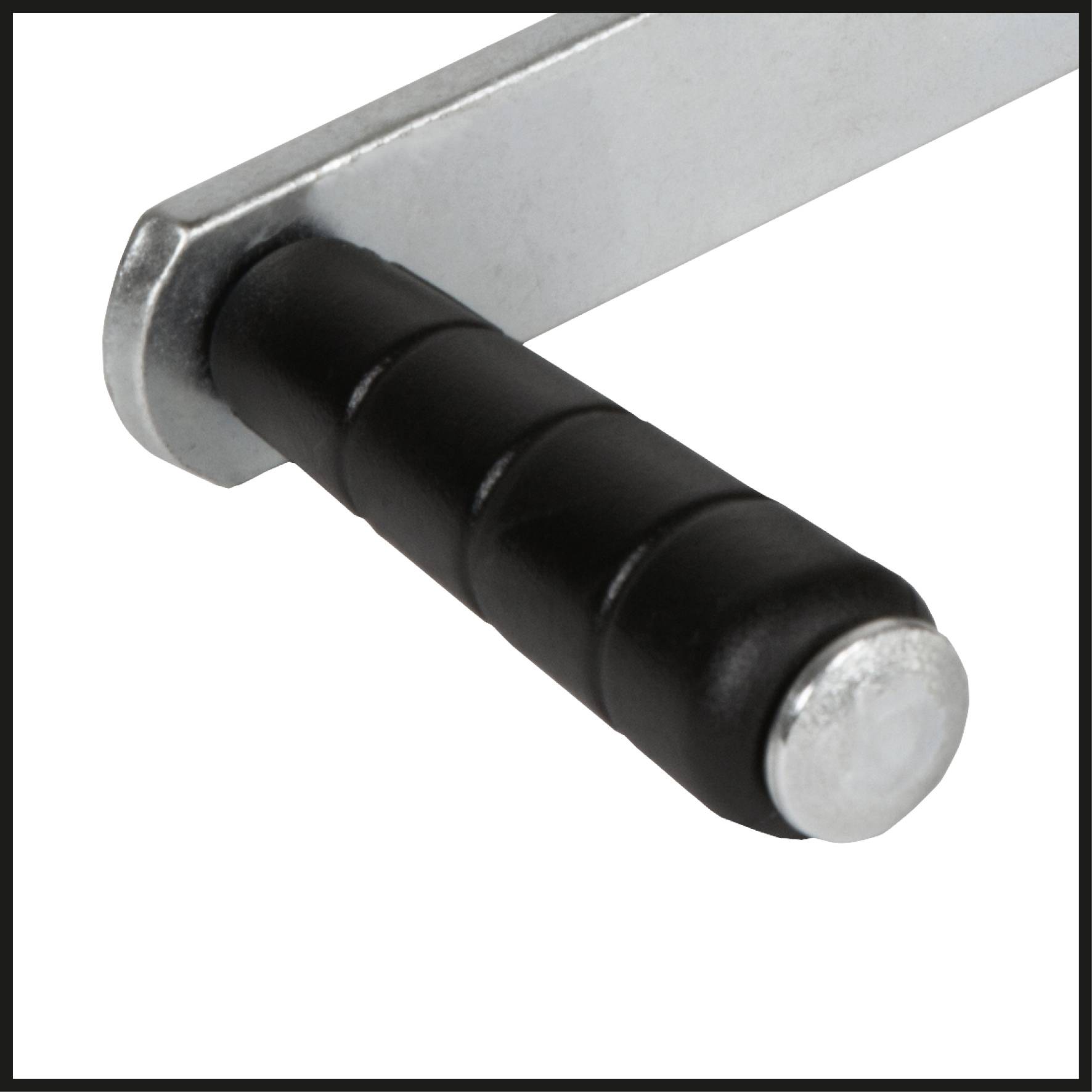 Close-up of a black handle on a silver lever, possibly part of a mechanical tool or device.