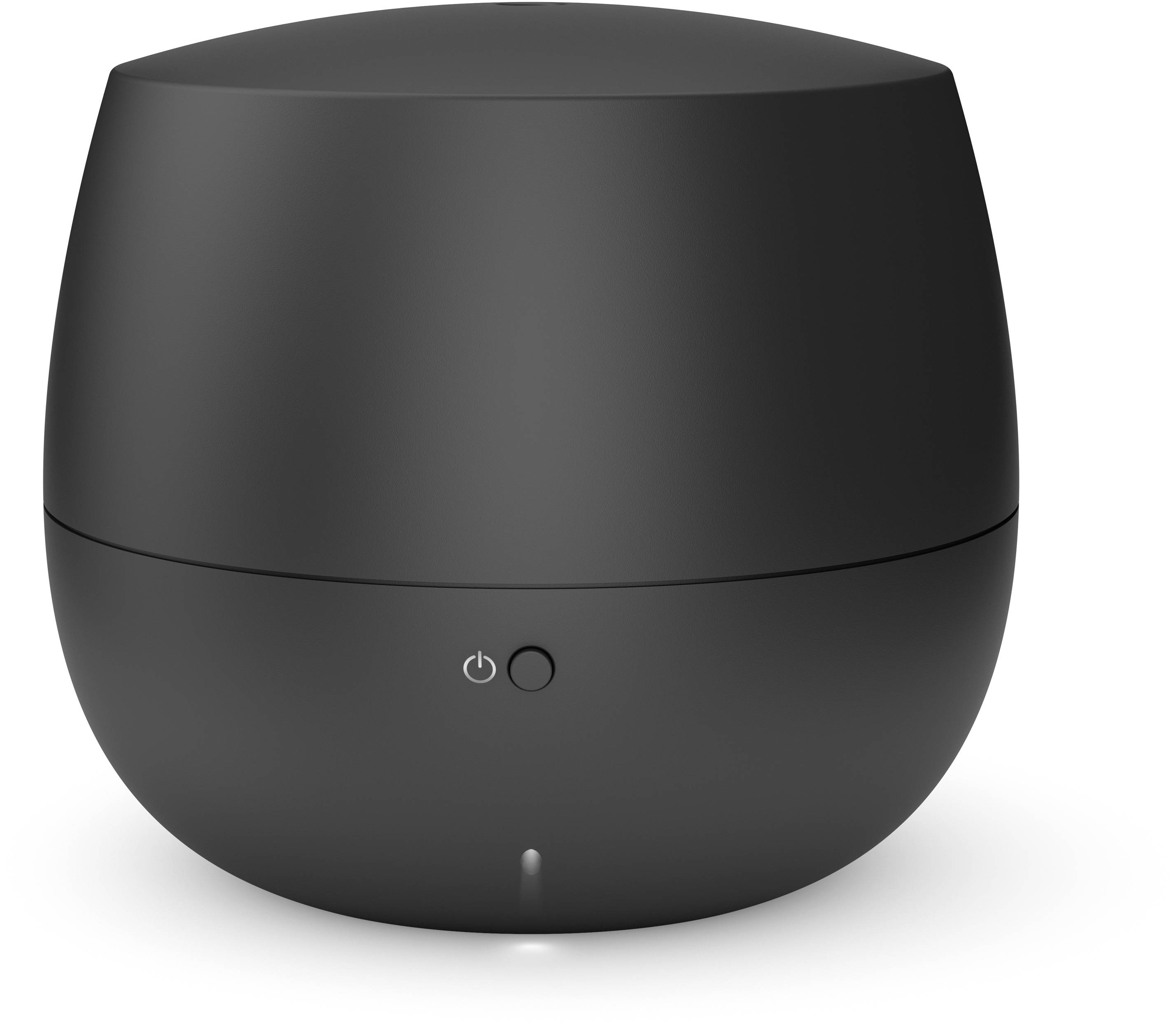 Black, round air humidifier with a central power switch on the front, standing on a flat surface.
