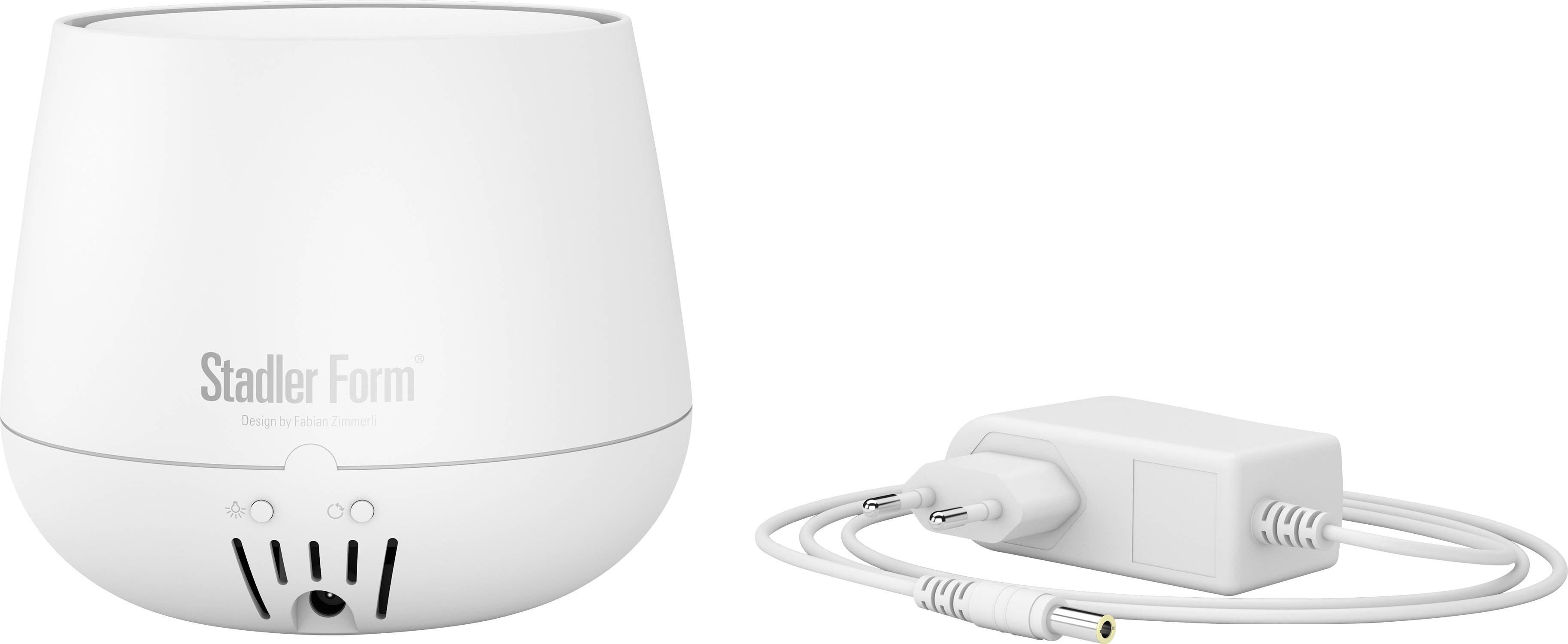 Humidifier in white next to a white power adapter, suitable for improving room climate.