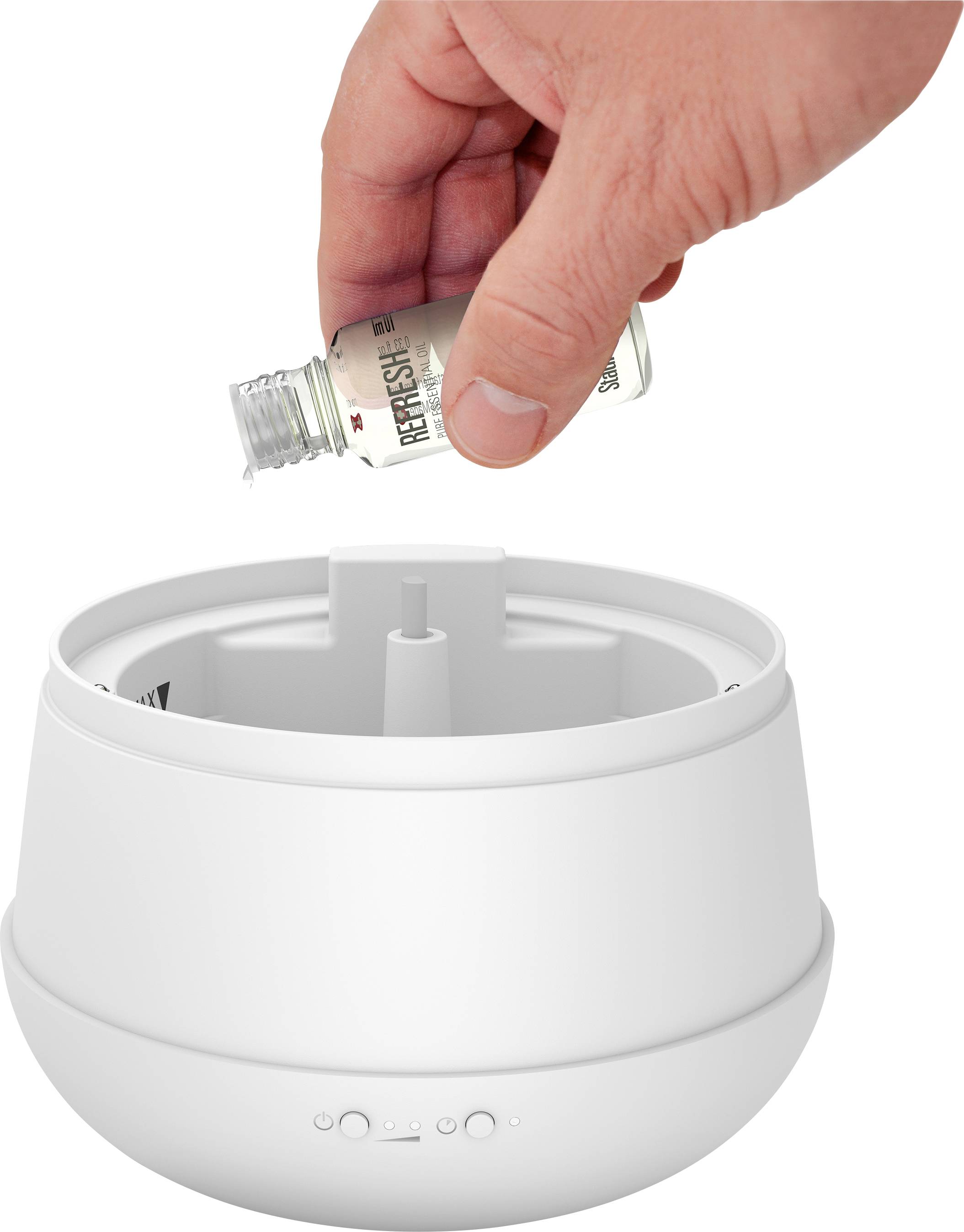 A hand fills 'Refresh' fragrance oil into a white aroma diffuser.