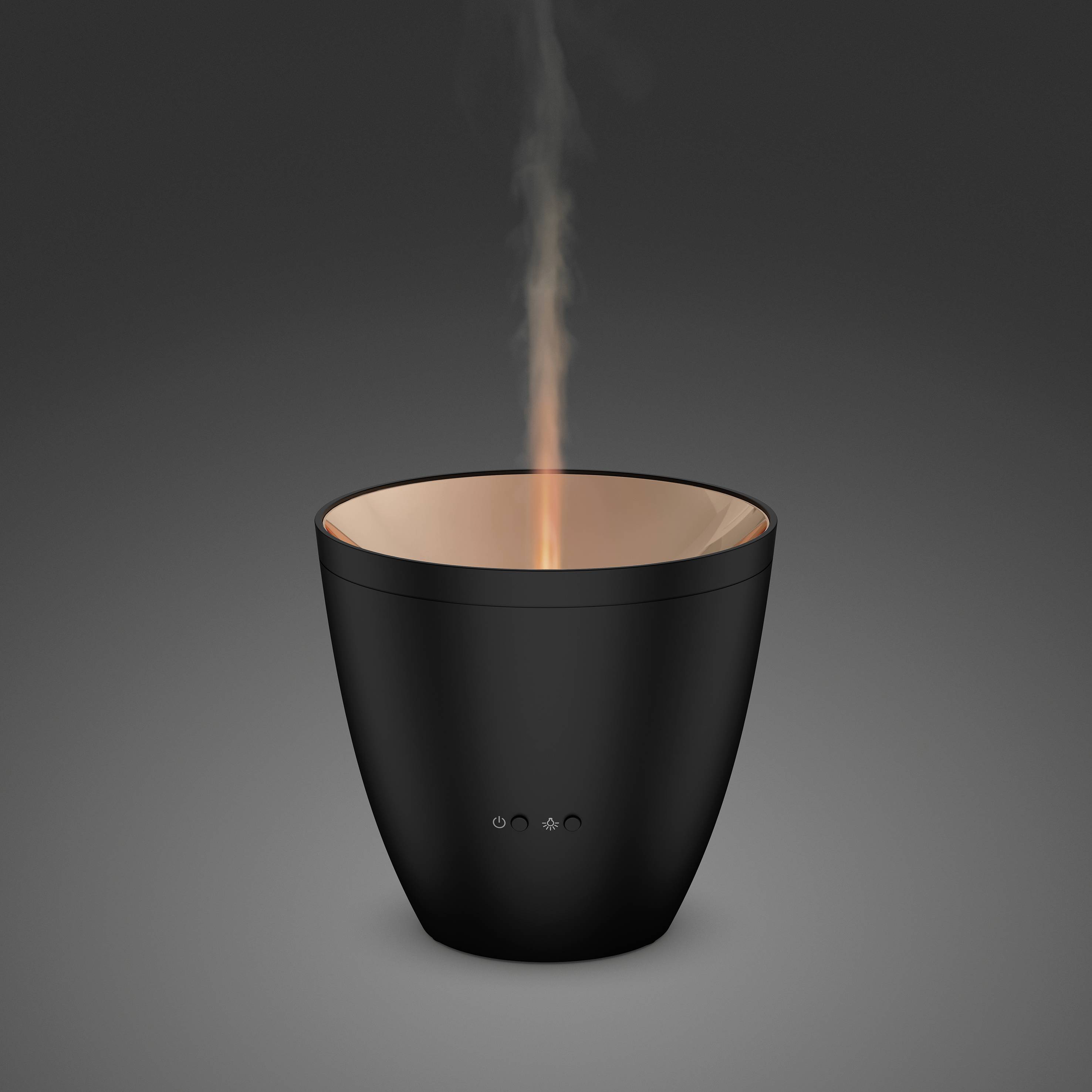 A black aromatherapy diffuser emits vapour upwards and sits against a grey background.
