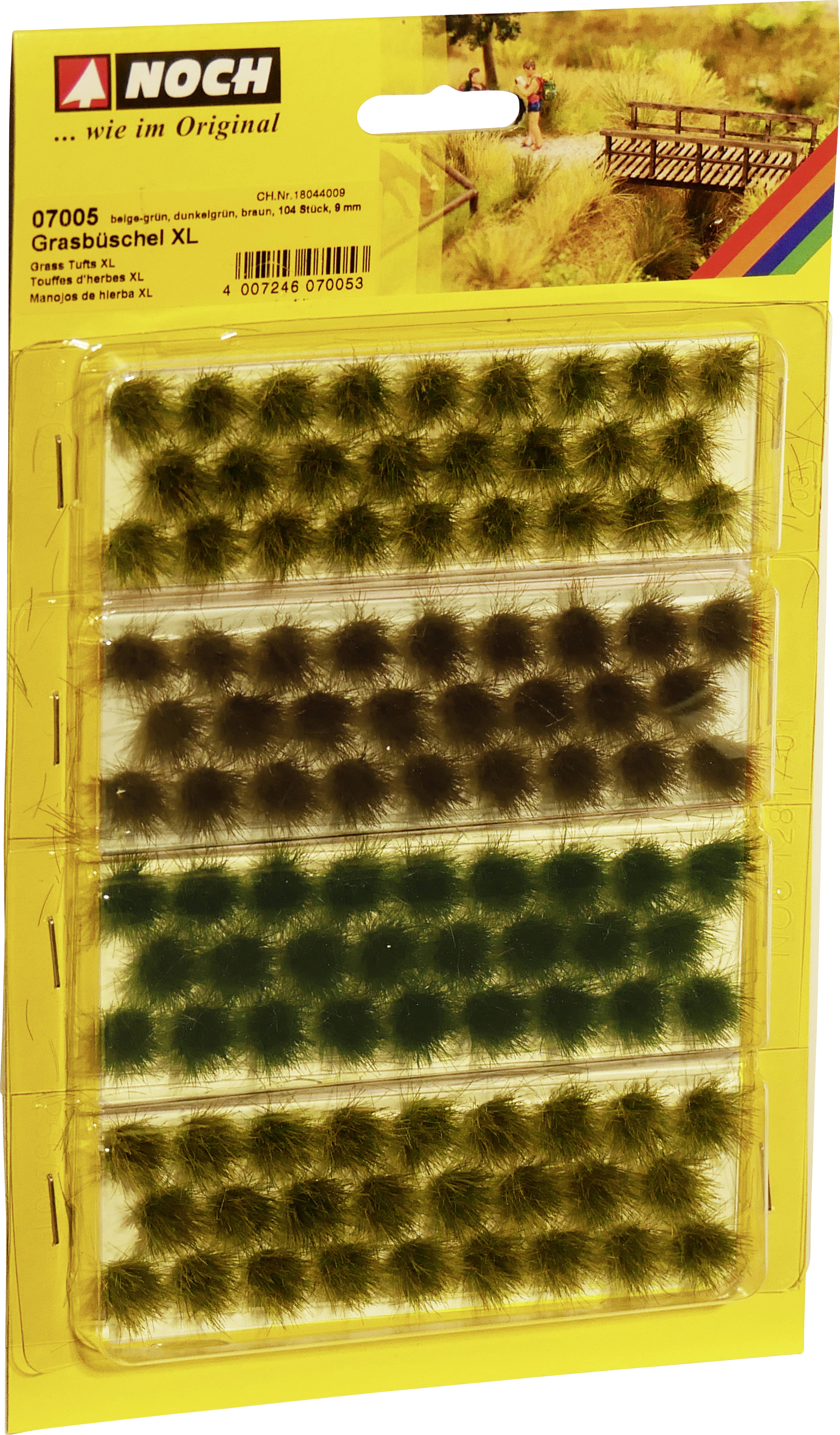 'Extra Large Grass Tufts' Modelling Set with large green grass tufts as an accessory for modelling terrain, in a yellow packaging.