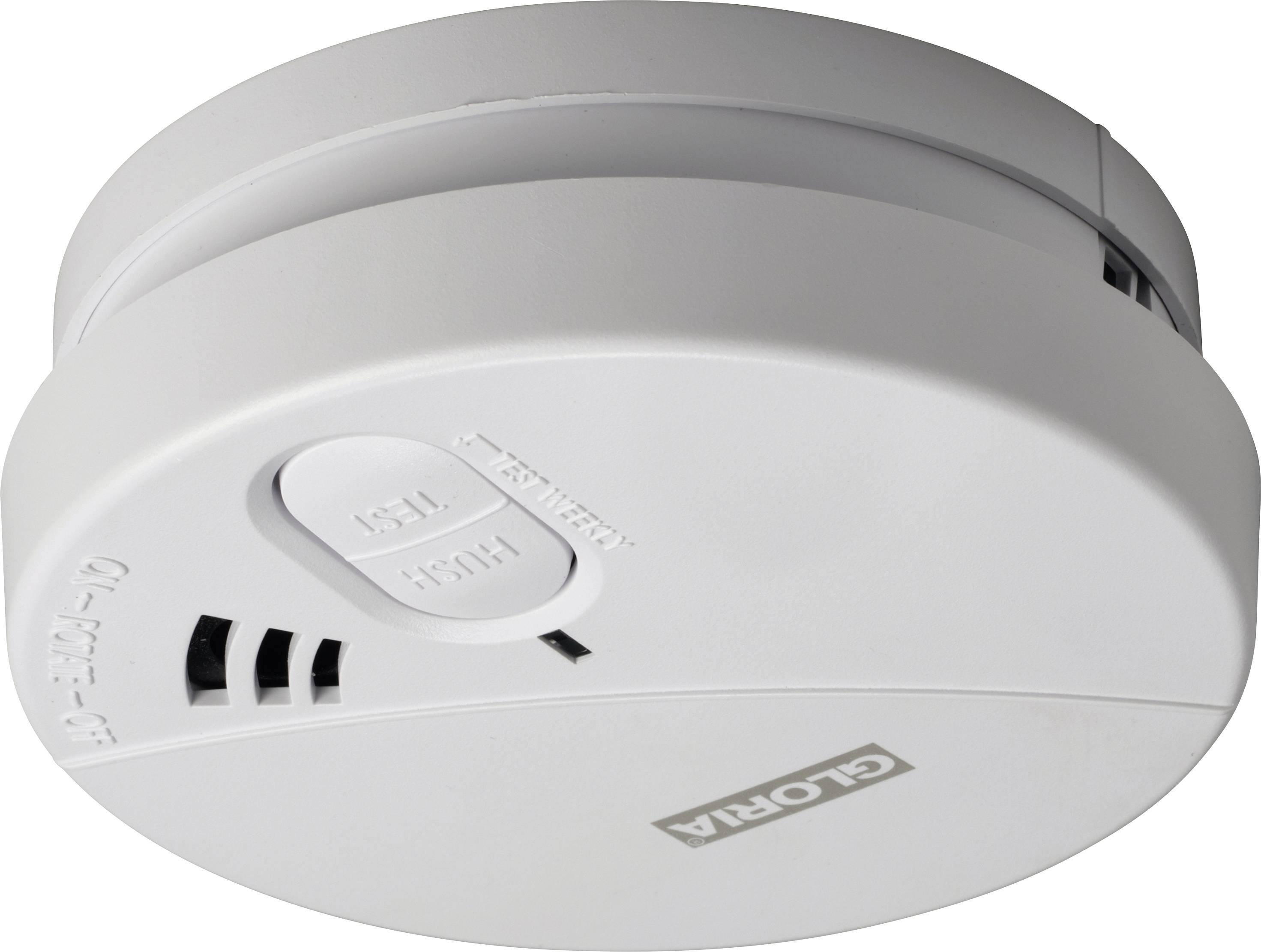 A white smoke detector is mounted on the ceiling. It has the labels 'Test' and 'Hush' and ventilation openings on the side.