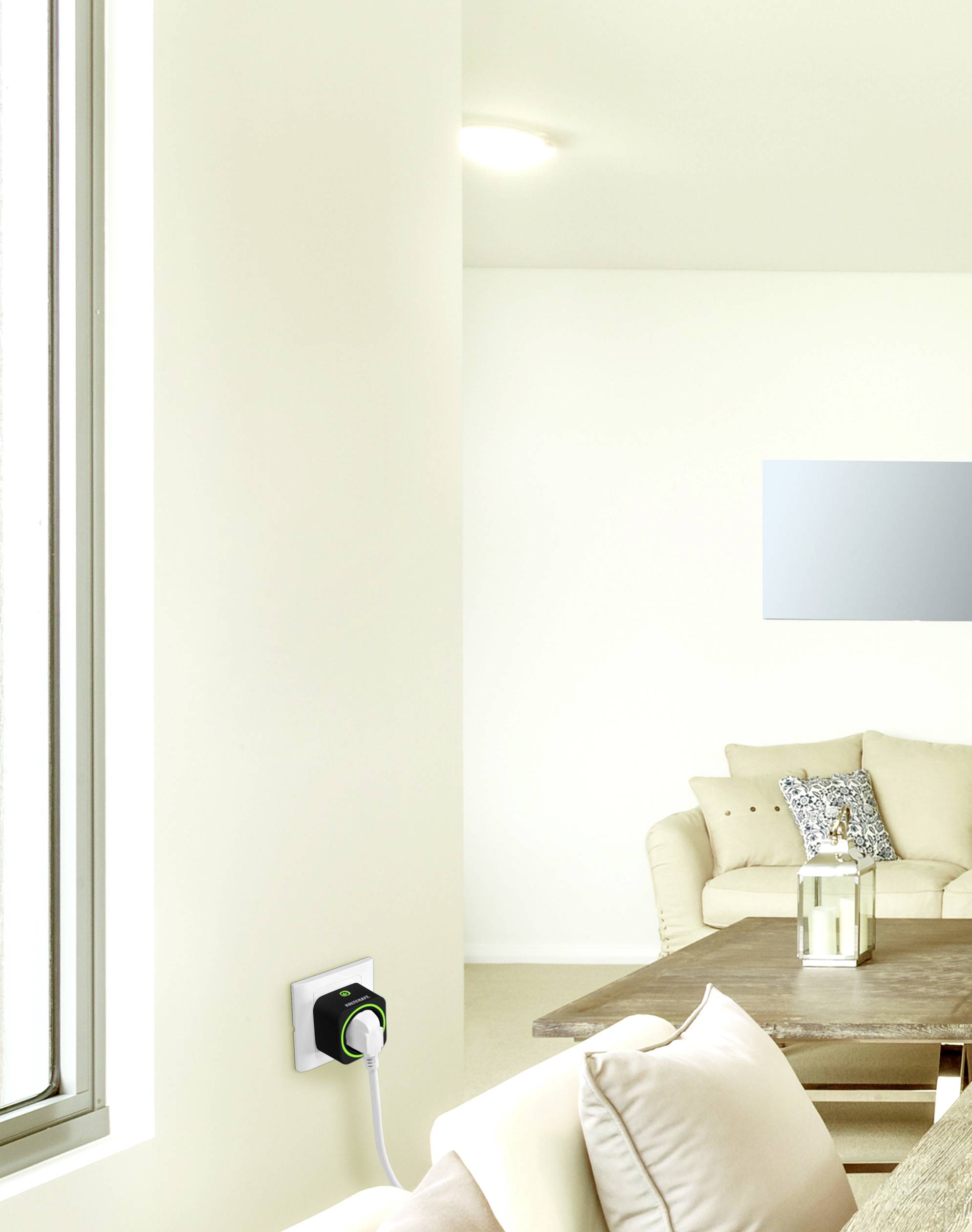 Modern living room with a beige sofa, wooden coffee table and power socket on the wall; minimalist decoration and bright lighting.