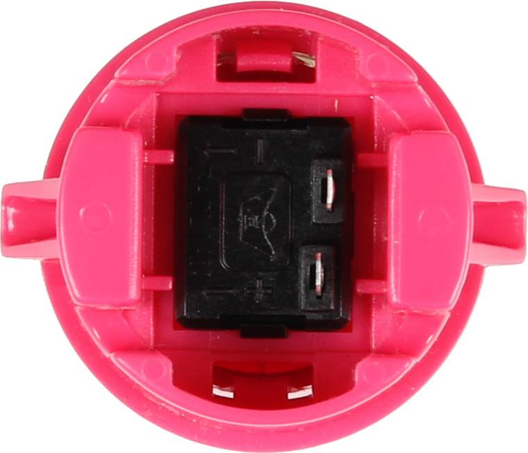 Red plastic cap with a black switch in the centre, viewed from above. This could be part of a larger device.
