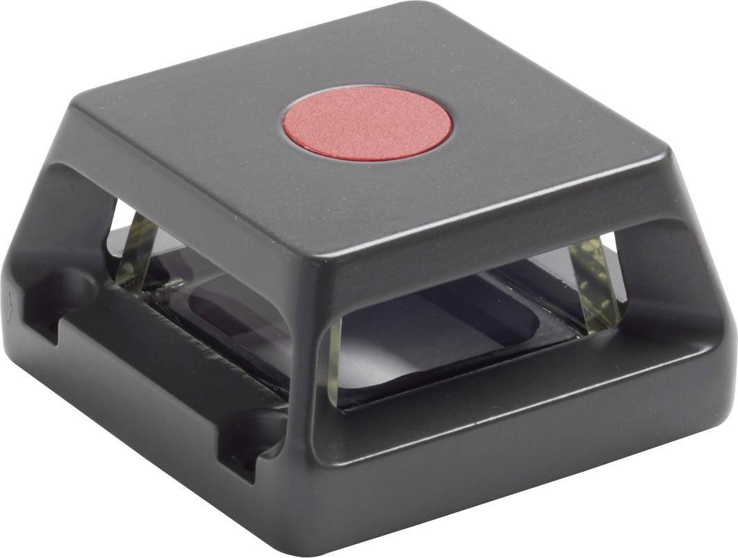 A square plastic enclosure with a red button on top, presumably an electronic component or switch.