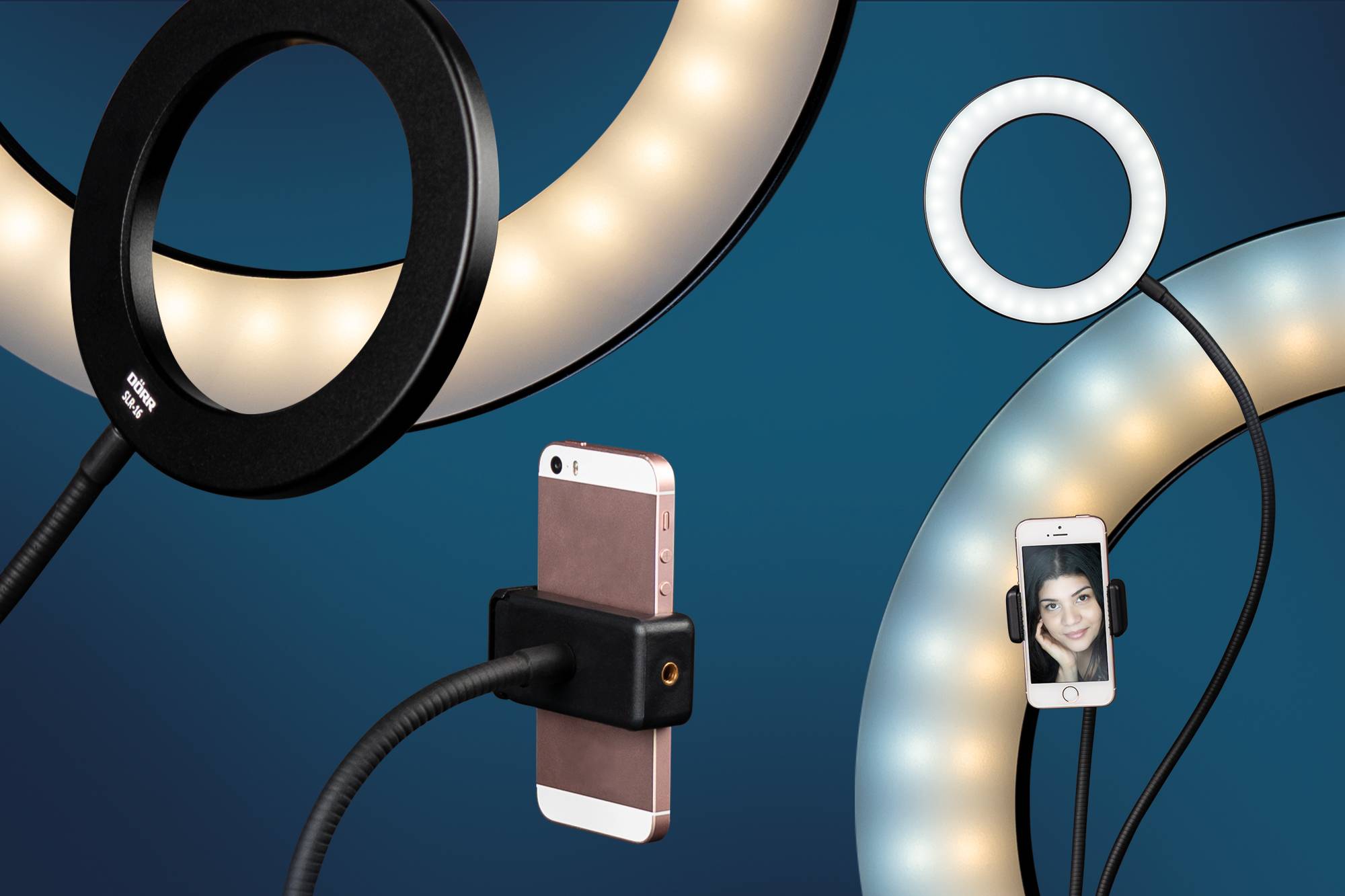 Three ring lights with smartphone holders, showing a device with a smiling person, against a blue background.