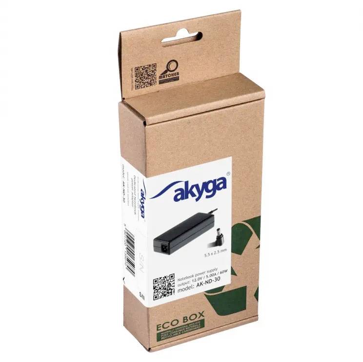 Brown packaging box for an 'akyga' power adapter, model 'AK-ND-30', 65W, featuring an image of the power supply and a technical QR code.