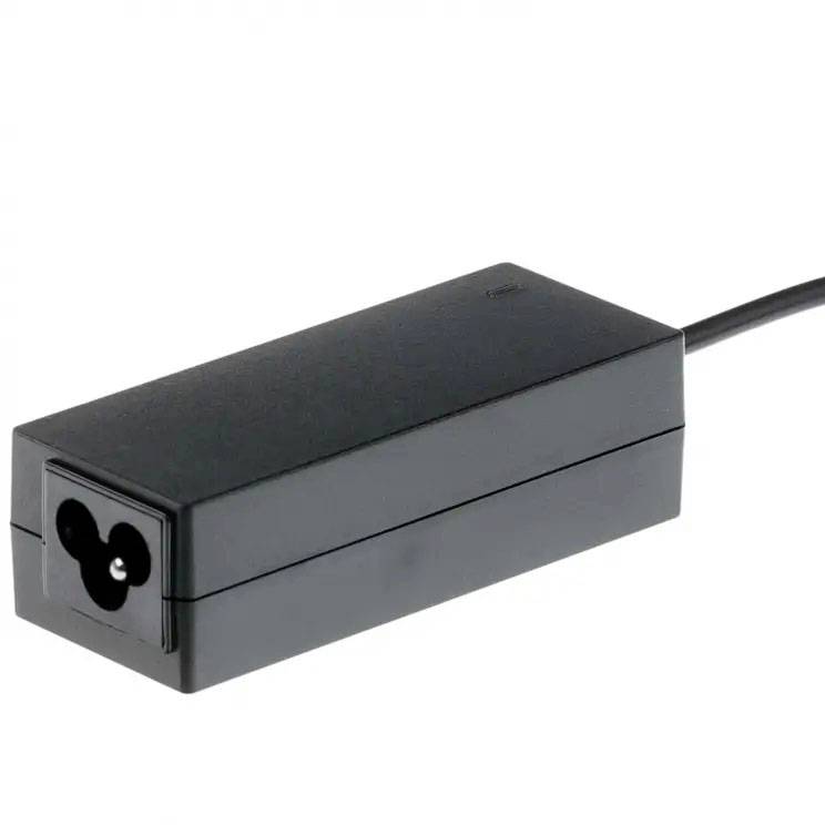 Black laptop charger with three-pin plug on white background.