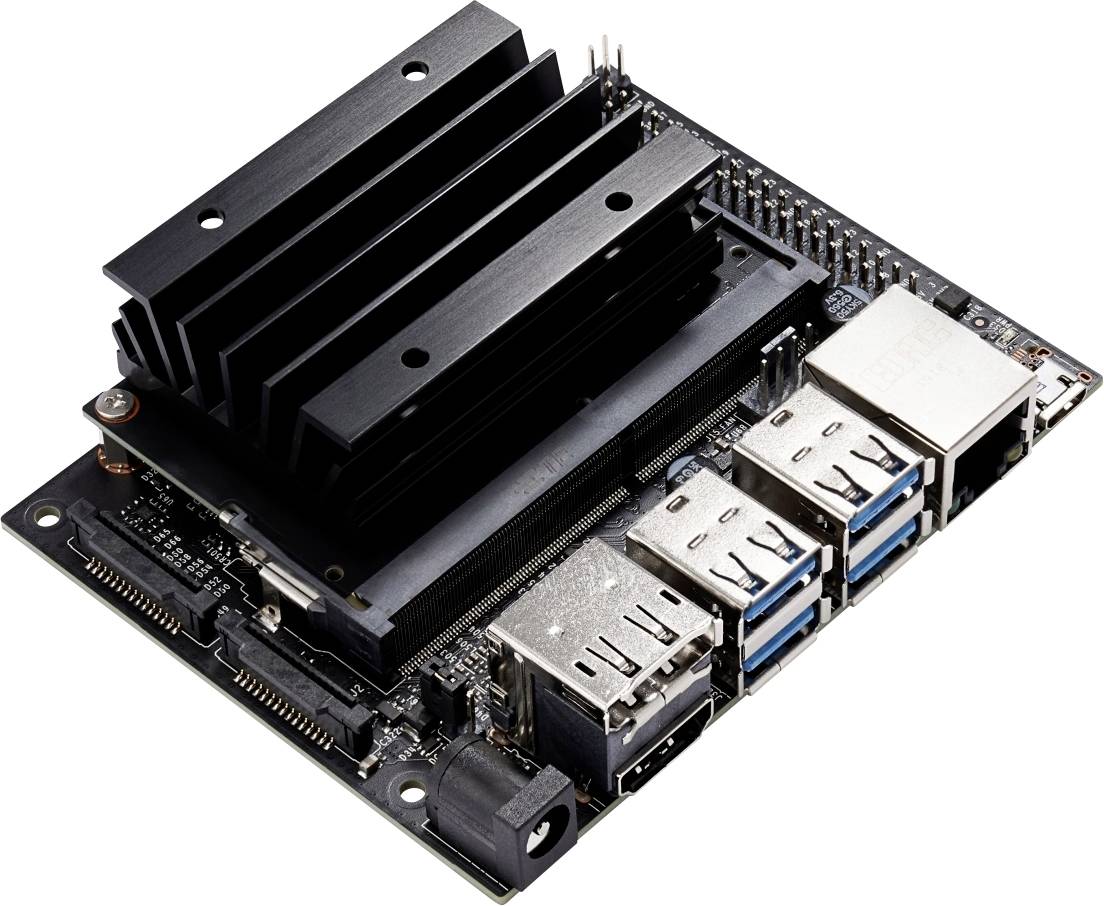 Electronic circuit board with multiple USB ports, Ethernet connection, and heatsink. It serves to connect and control electronic devices.