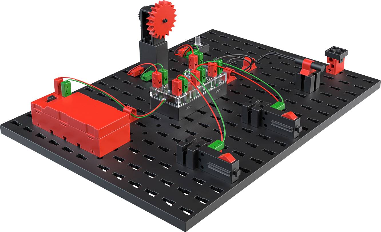 Breadboard with various modular components and wiring for demonstrating a mechanical or electrical system.