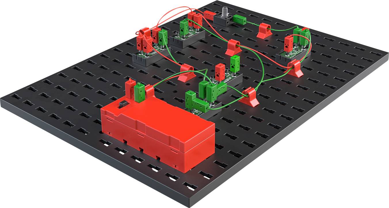Simulation board with red and green electronic components and wires on a black base, showing circuit connections.