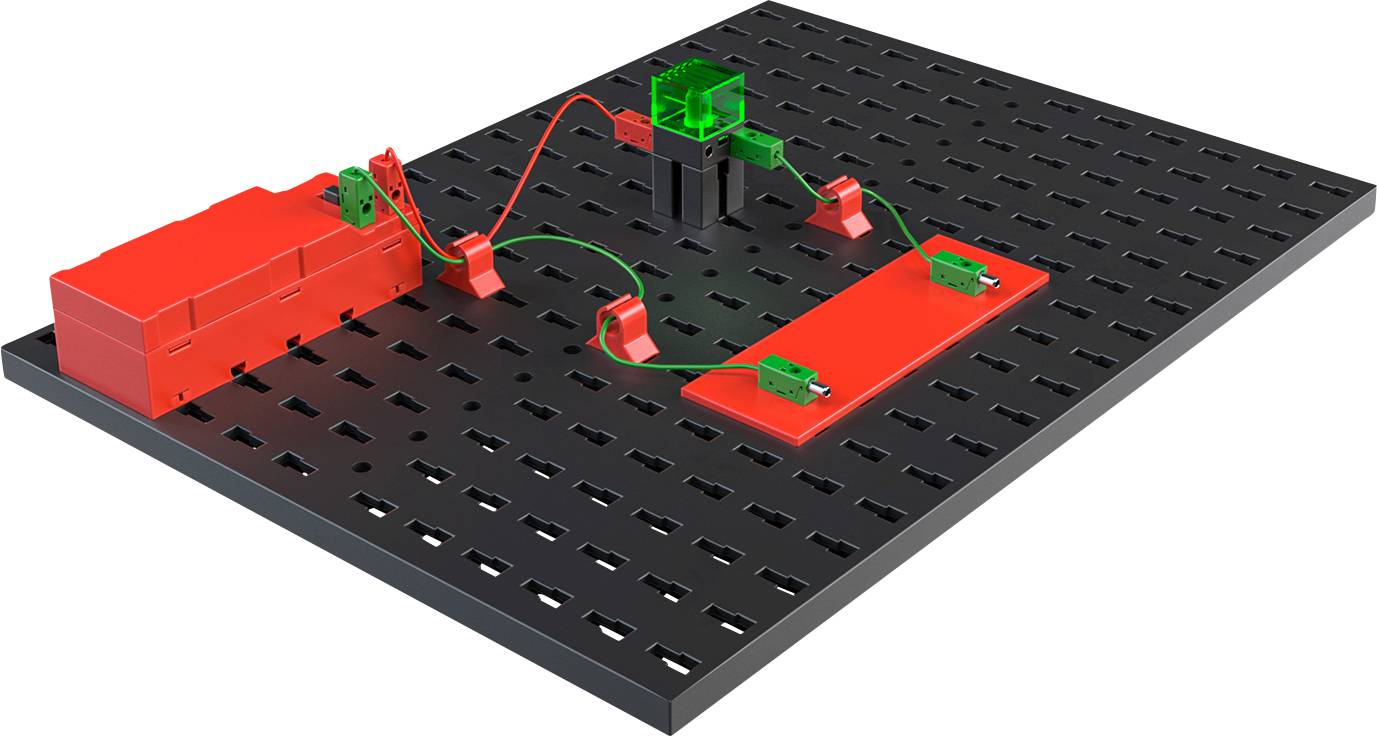A circuit experimentation board with a battery, connected via cables to an LED and a switch, demonstrates electrical current flow.
