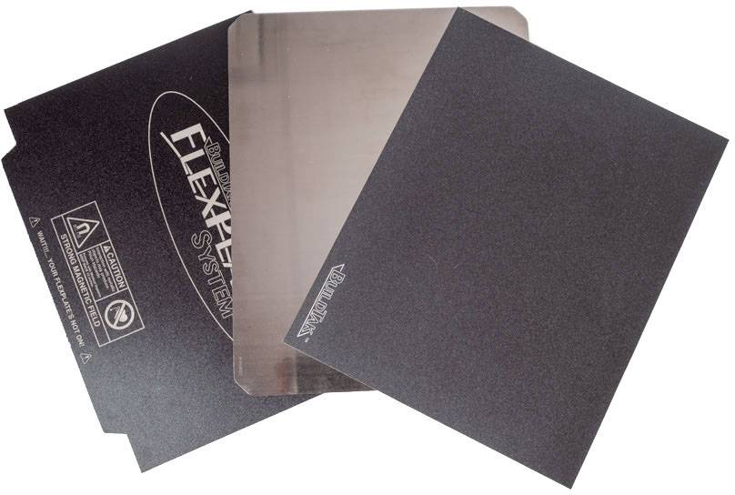 Three black plastic panels with the imprint 'FLEXPELL SYSTEM'. One panel displays symbols for caution and non-recyclability.