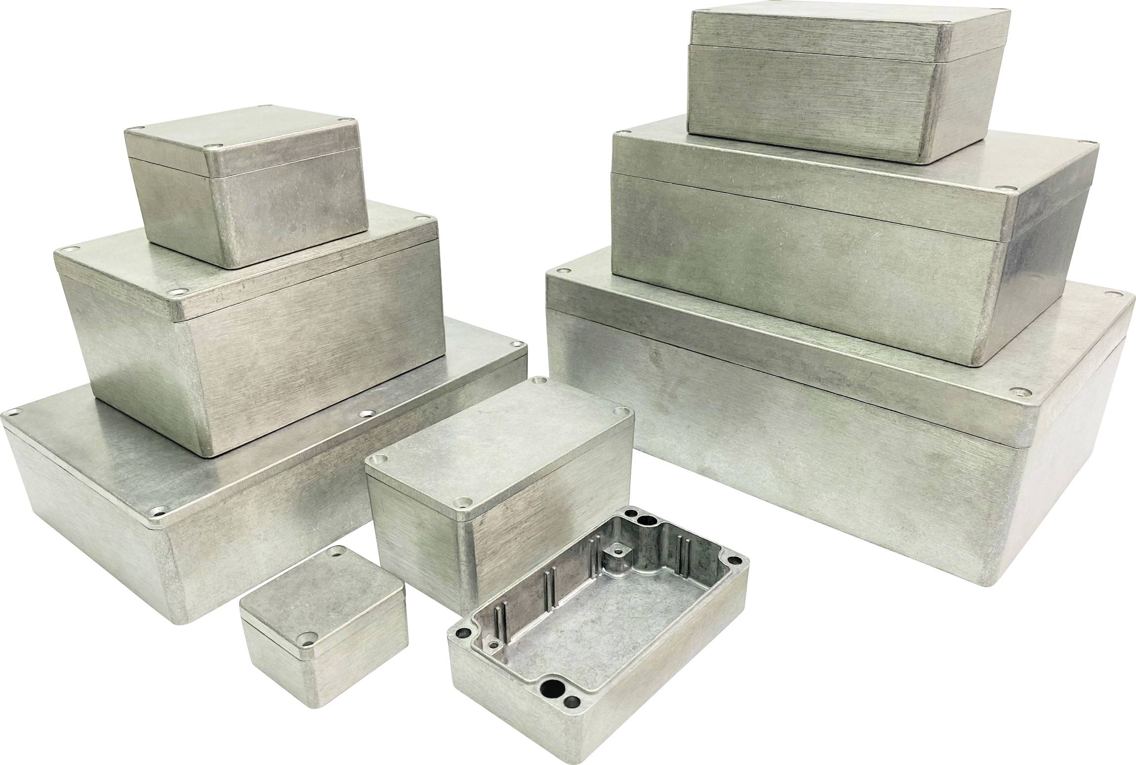 Several rectangular metal enclosures in various sizes, stacked and grouped side by side. One enclosure reveals its open interior.